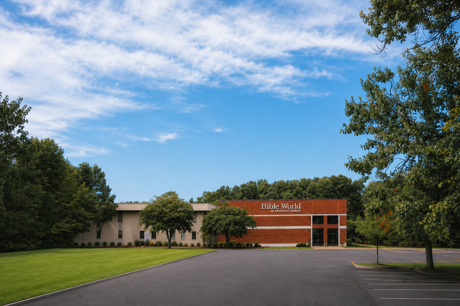 Exterior view of Bible World, an apostolic church, with a parking lot and surrounding trees under a blue sky with some clouds.