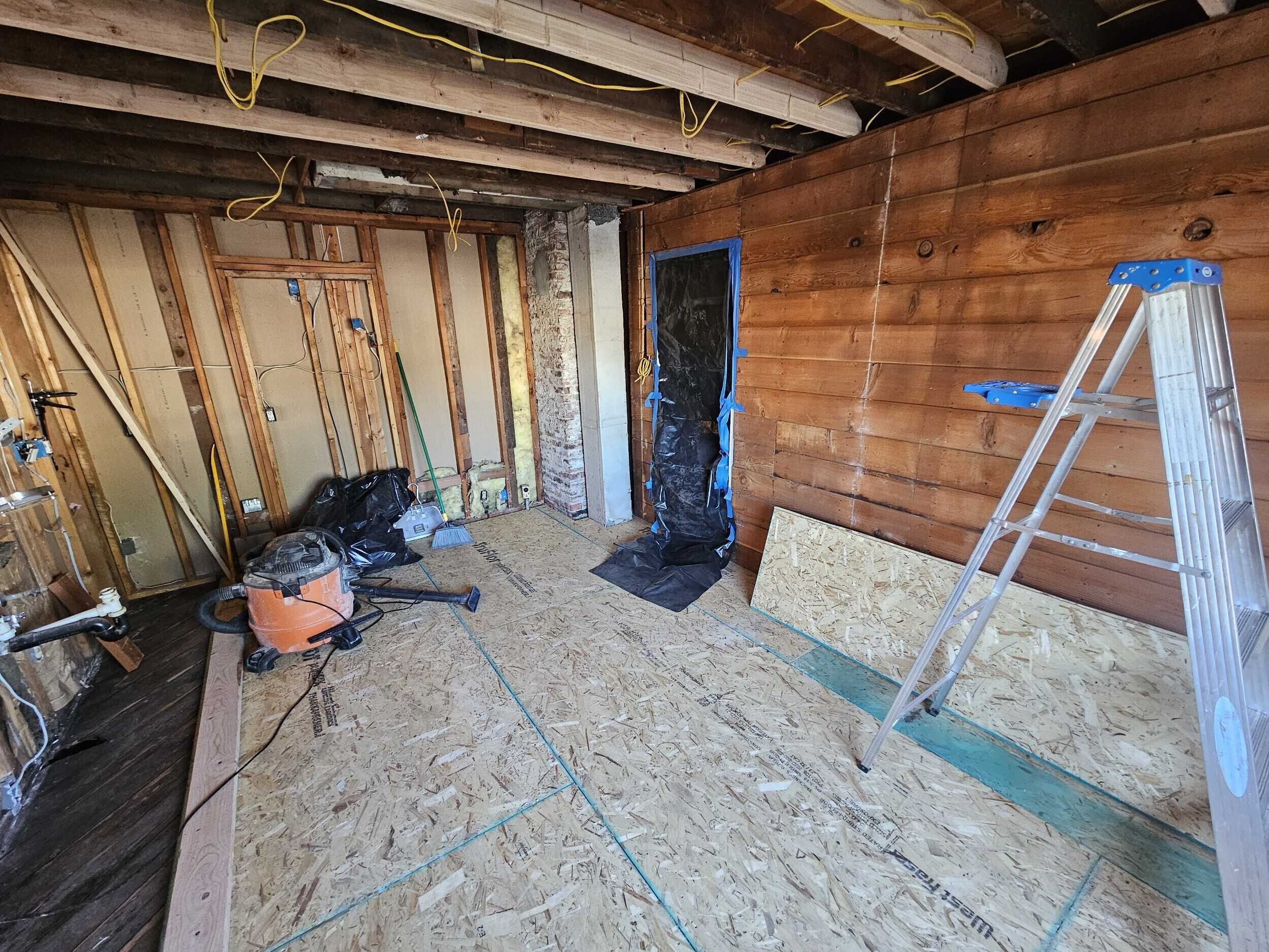 Added structural support, new subfloor, and rewired most of the electrical to bring it up to code