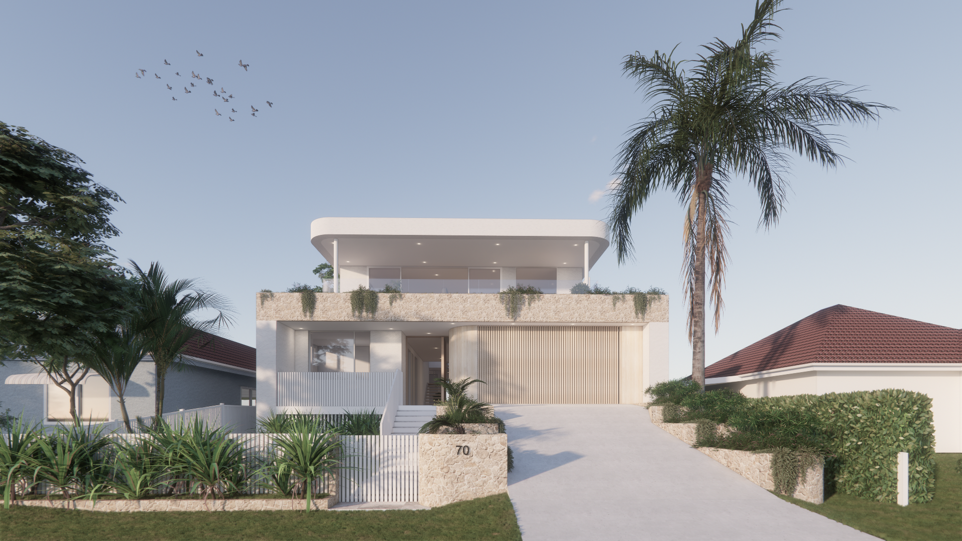 Front view of a two story stone cladded home with a garage with a large door, stone accents, raised home and driveway due to flood levels in Narrabeen Lagoon,  grassy area with stepping stones, palm trees, and a white fence with stone cladding.