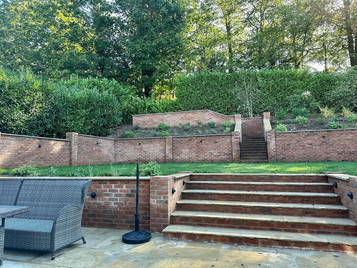 This garden in Oxshott is nearly complete - a much more family friendly and appealing space (swipe through for before)