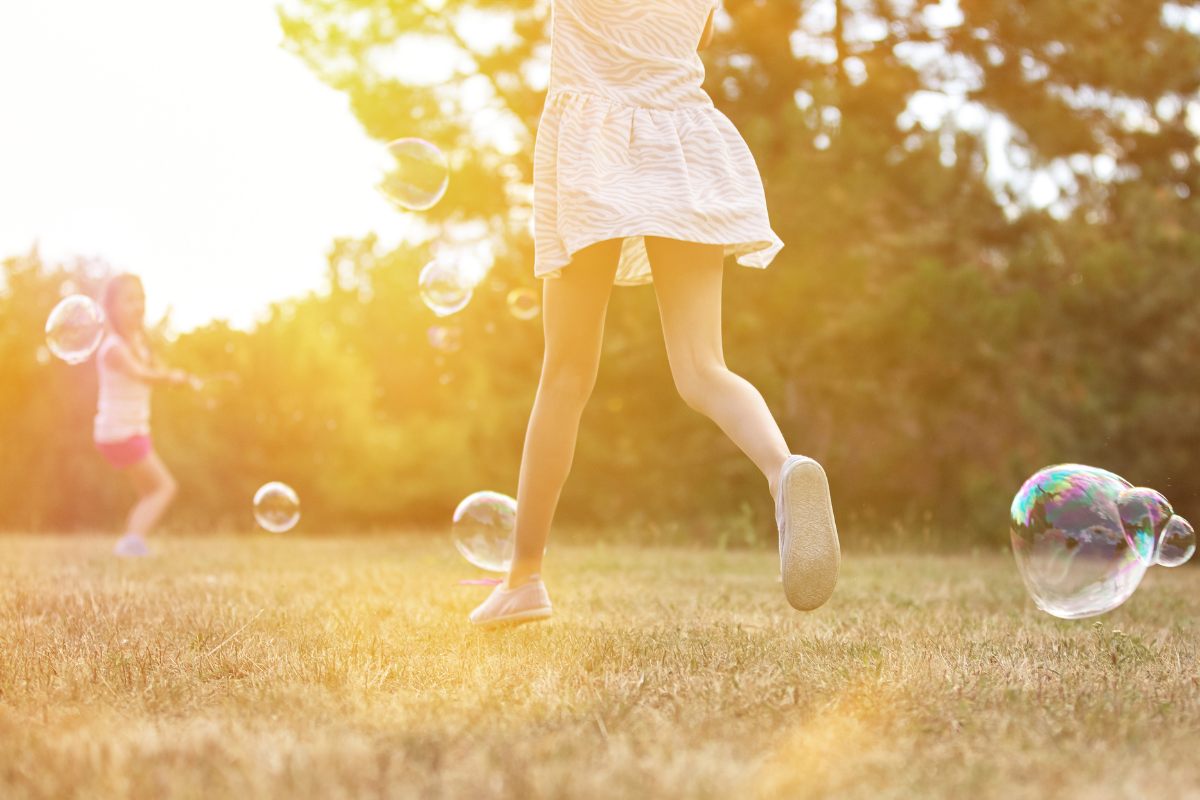 Why is my child so emotional after school ends? Children playing outside during summer break.