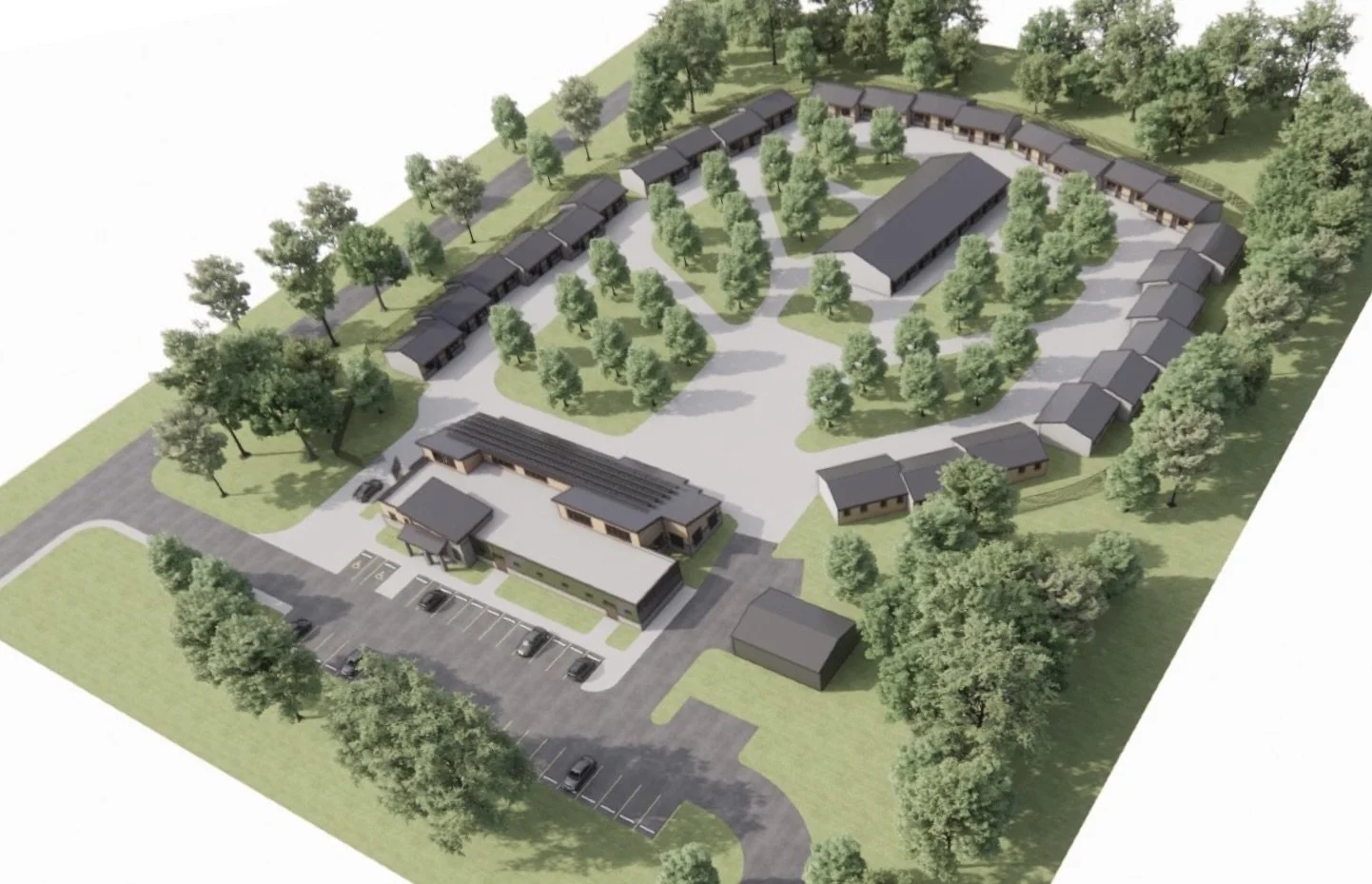 Aerial view of a modern residential community with multiple houses, trees, roads, and a parking lot.