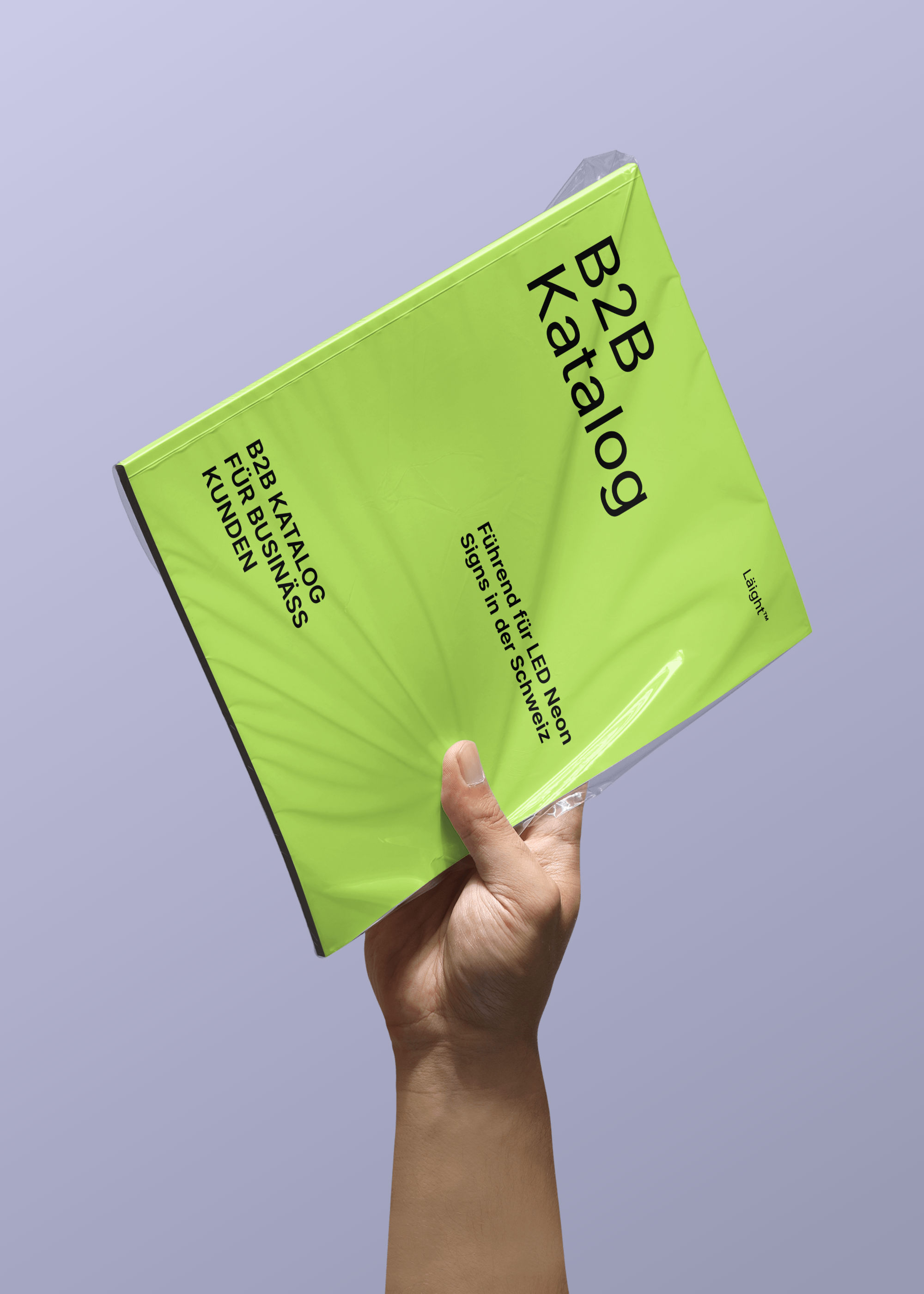hand-holding-plastic-wrapped-magazine-mockup-template-6aad0320e48f6c3e475bcb73-@2x.png