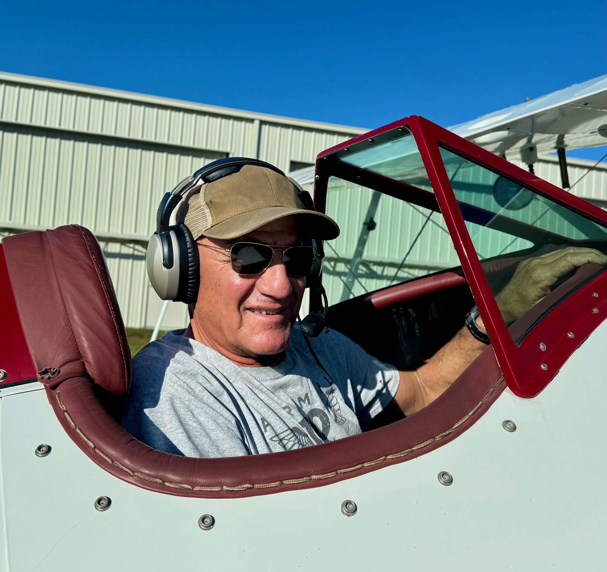 Pilot John Manchester sitting in Gracie, Suncoast Biplanes WACO biplane.