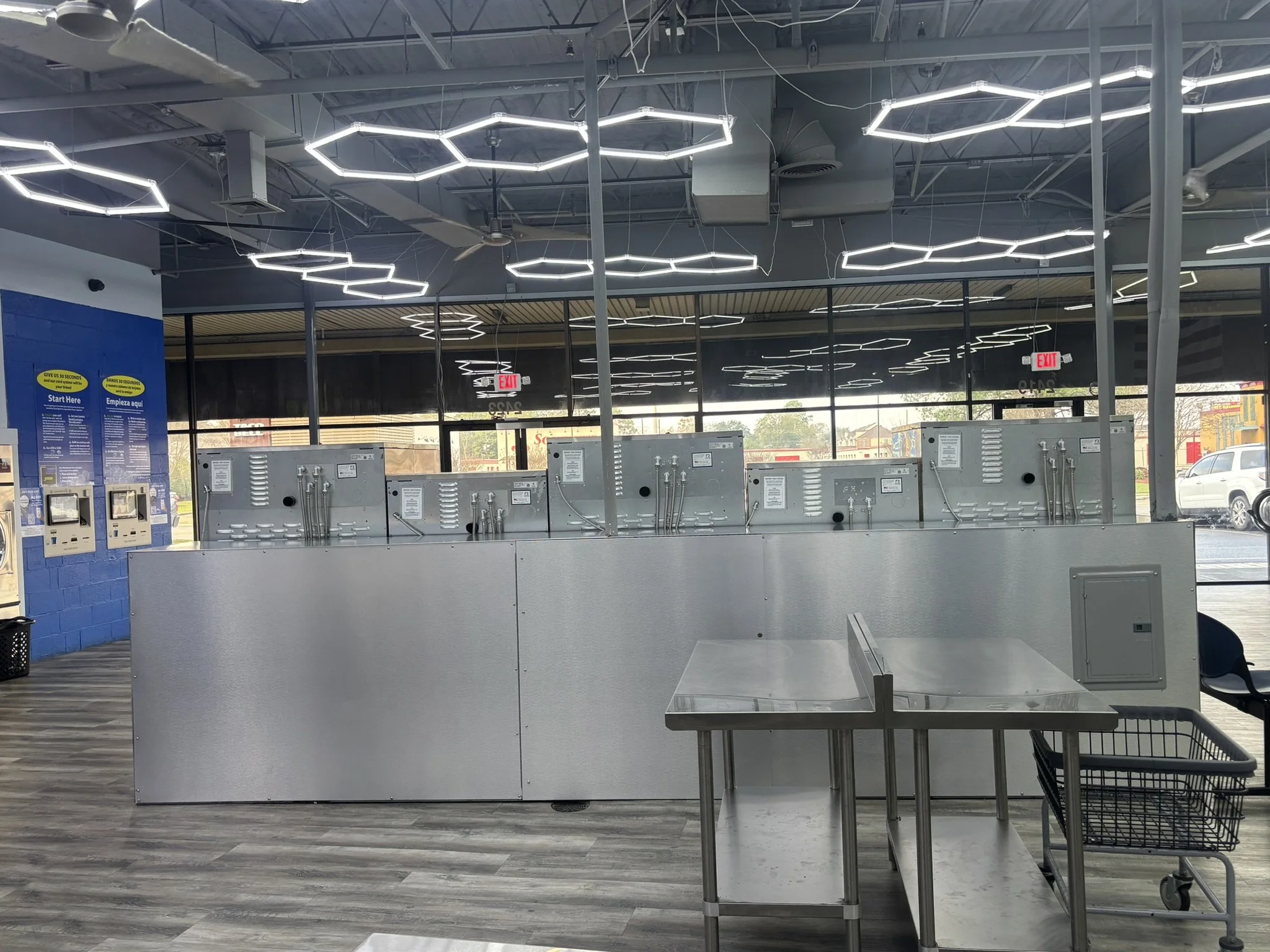 Freedom Bulkhead installed in a laundromat surrounded by tables.