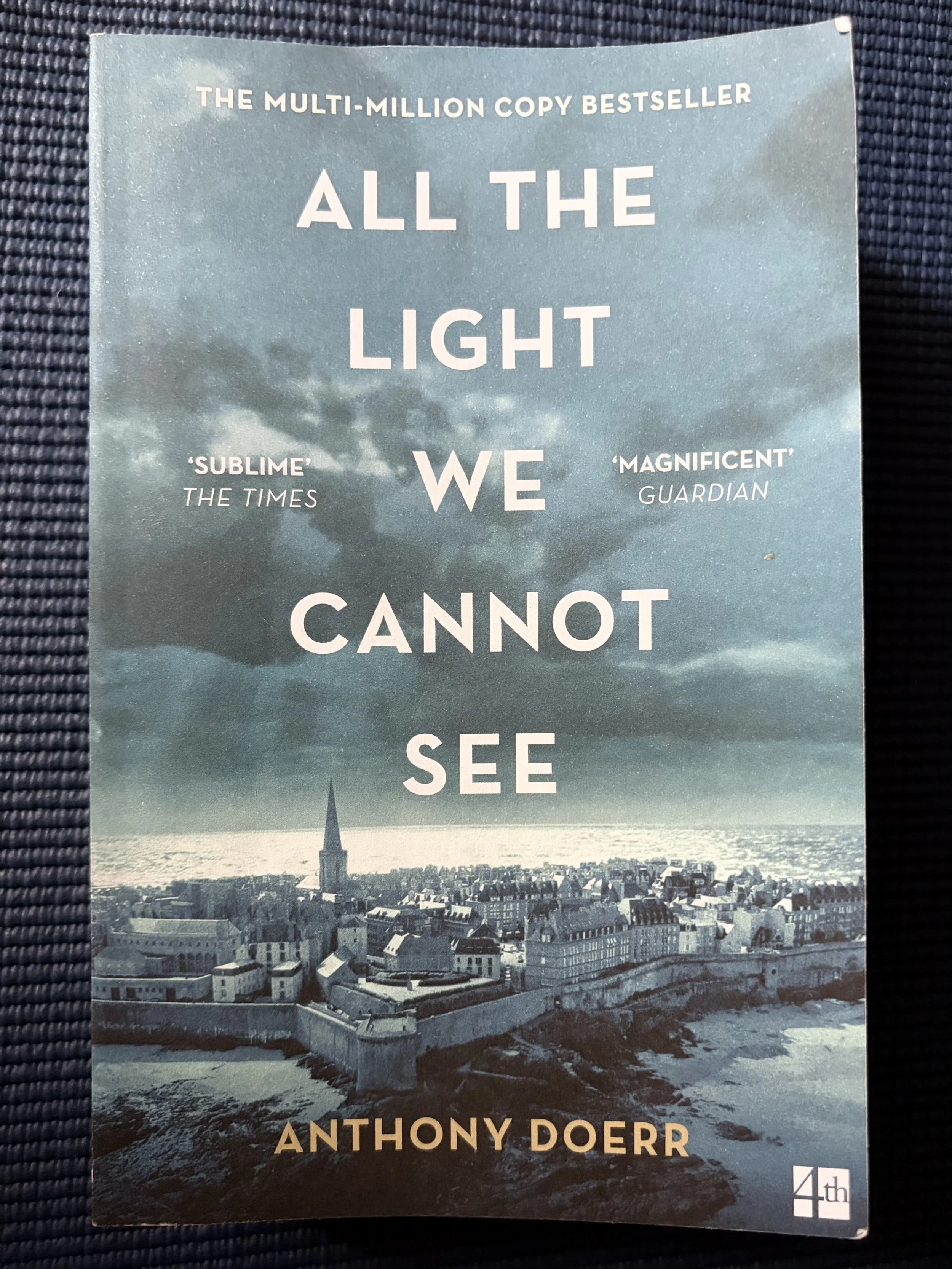 All the Light We Cannot See on top of blue background