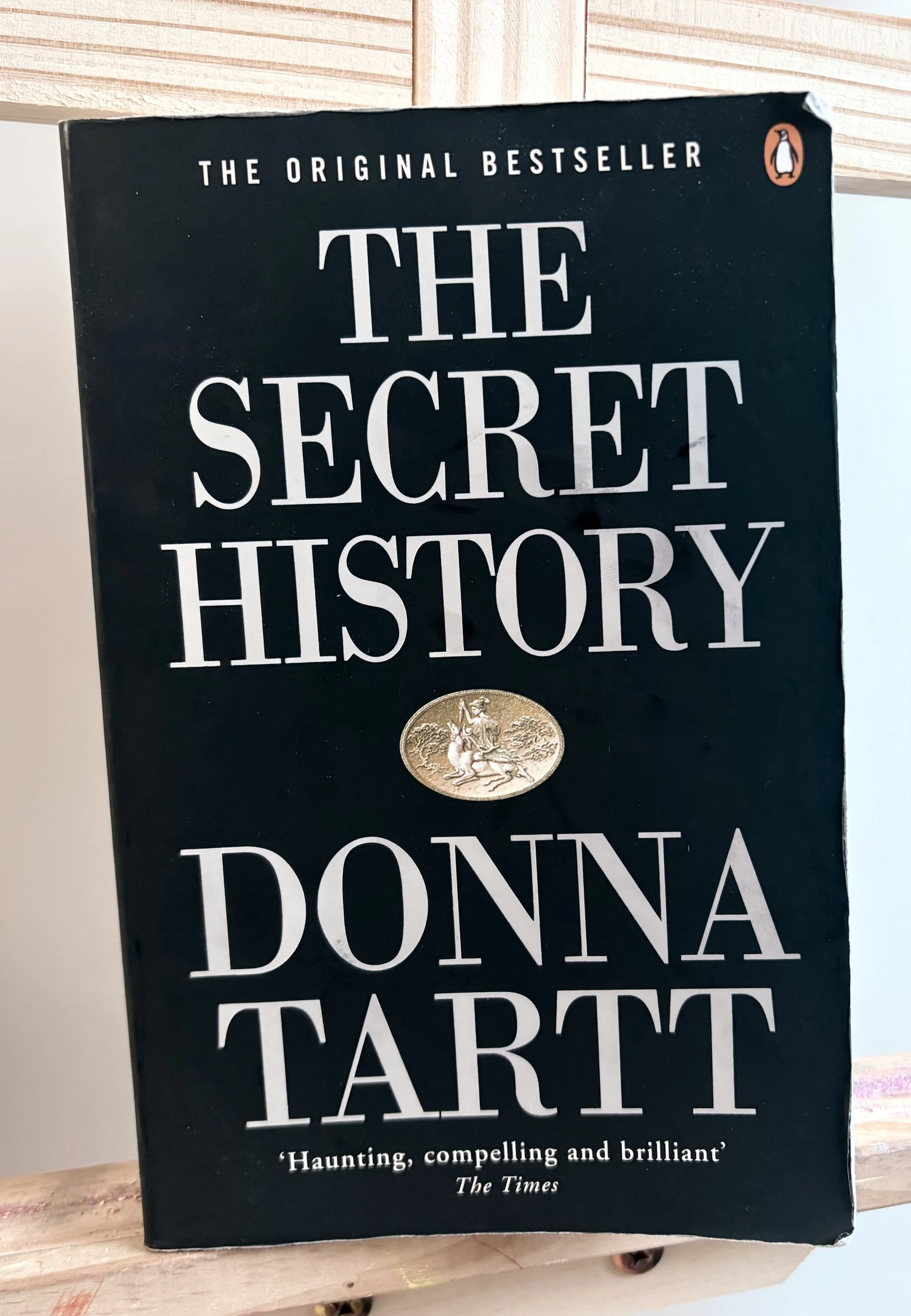 The Secret History perched on an easle