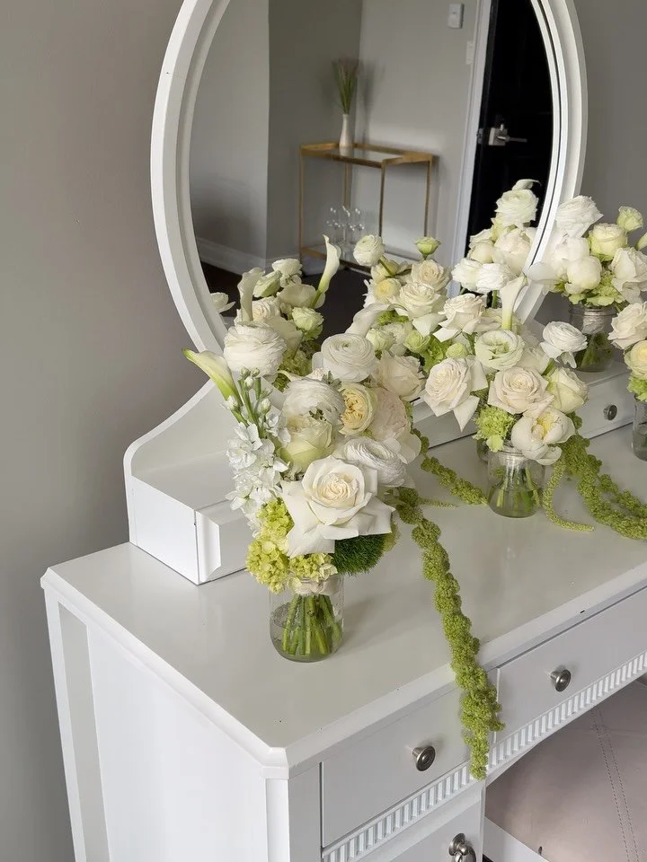 A Harding Waterfront Estate wedding always has its own kind of magic. 

Petite bridal party bouquets held by the maids framed the floral pillars as the wind spent in across rows of ribbons. 

Inside the tent, caterpillar tables dressed in rich satin,