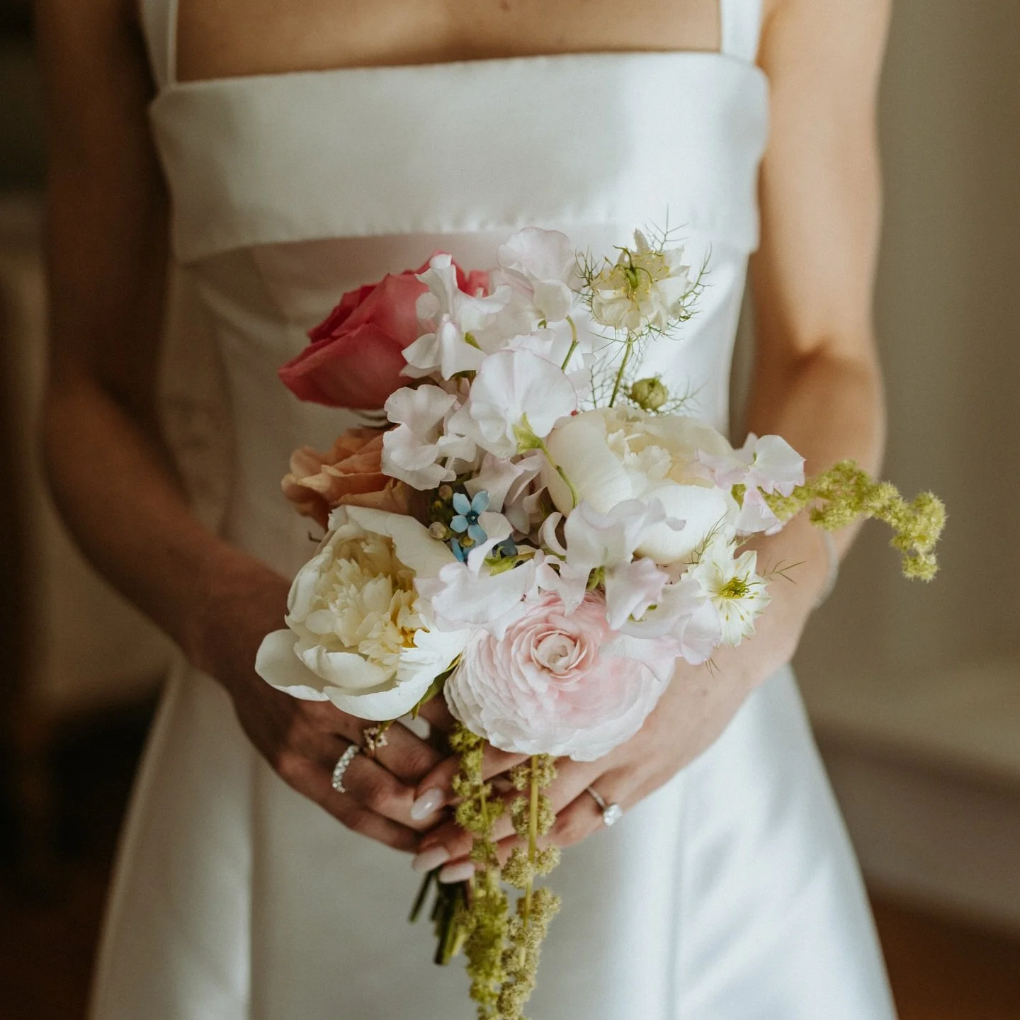 Jackie and Andrew&rsquo;s Langdon Hall wedding felt like stepping into a pastel daydream. 

Soft, romantic blooms in blush, peach, and lilac were wild yet refined, echoing the timeless beauty of Langdon Hall itself and danced in the golden light, the