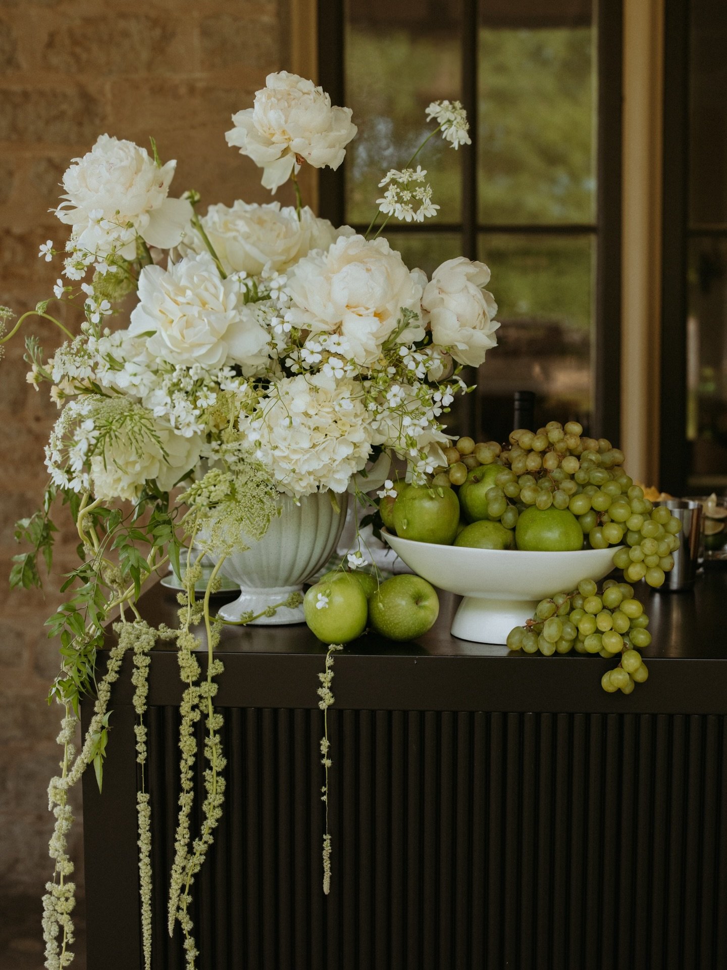 An early evening Welcome Dinner at Cruickston Park. 

The vibe was Provence garden chic with soft, fluffy white florals, wicker candles nestled among overflowing pears and grapes, and big hydrangea filled baskets. 

With rolling hills, endless trees,