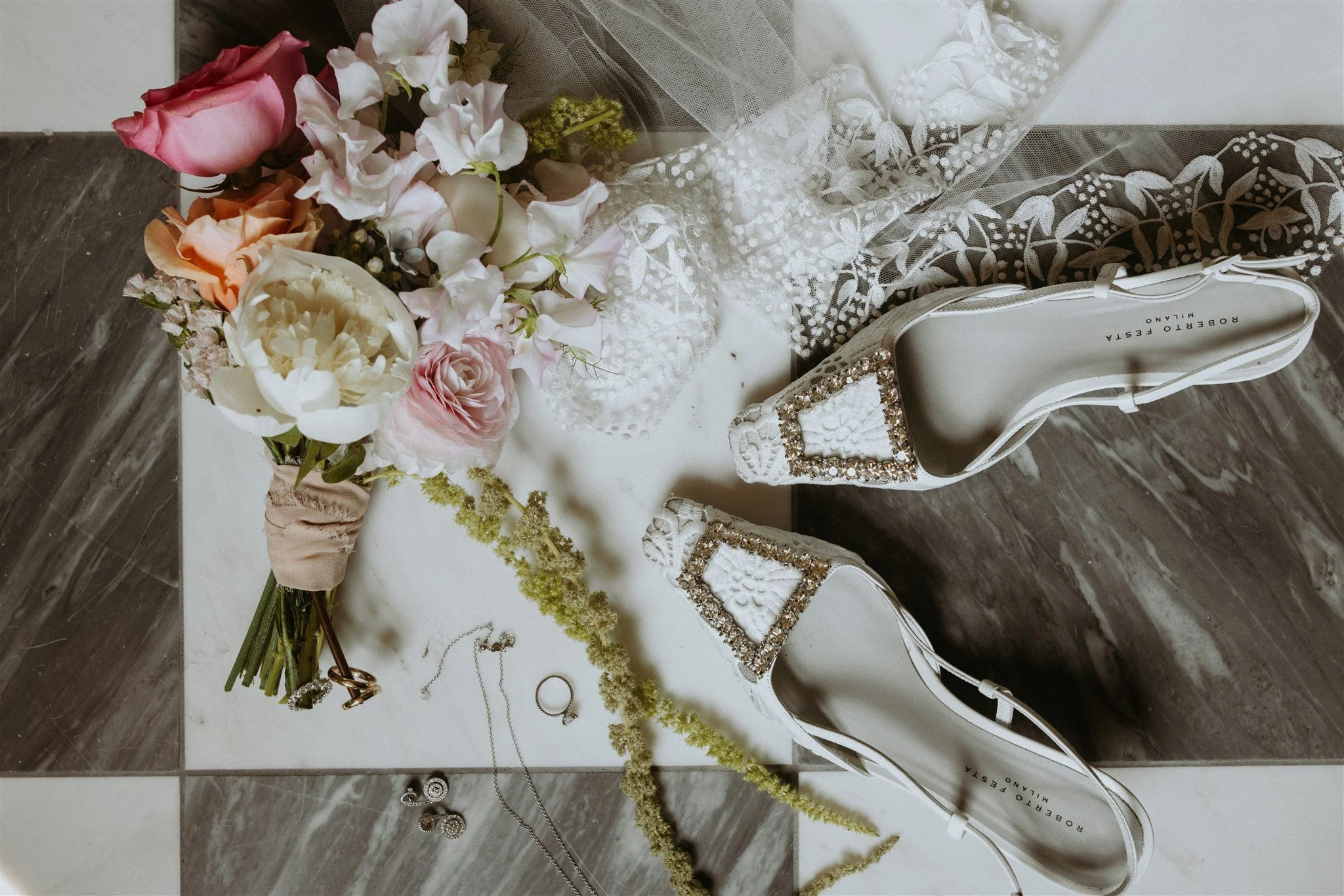Flatlay of a Wild Vogel Works bouquet and Roberto Festa bridal shoes