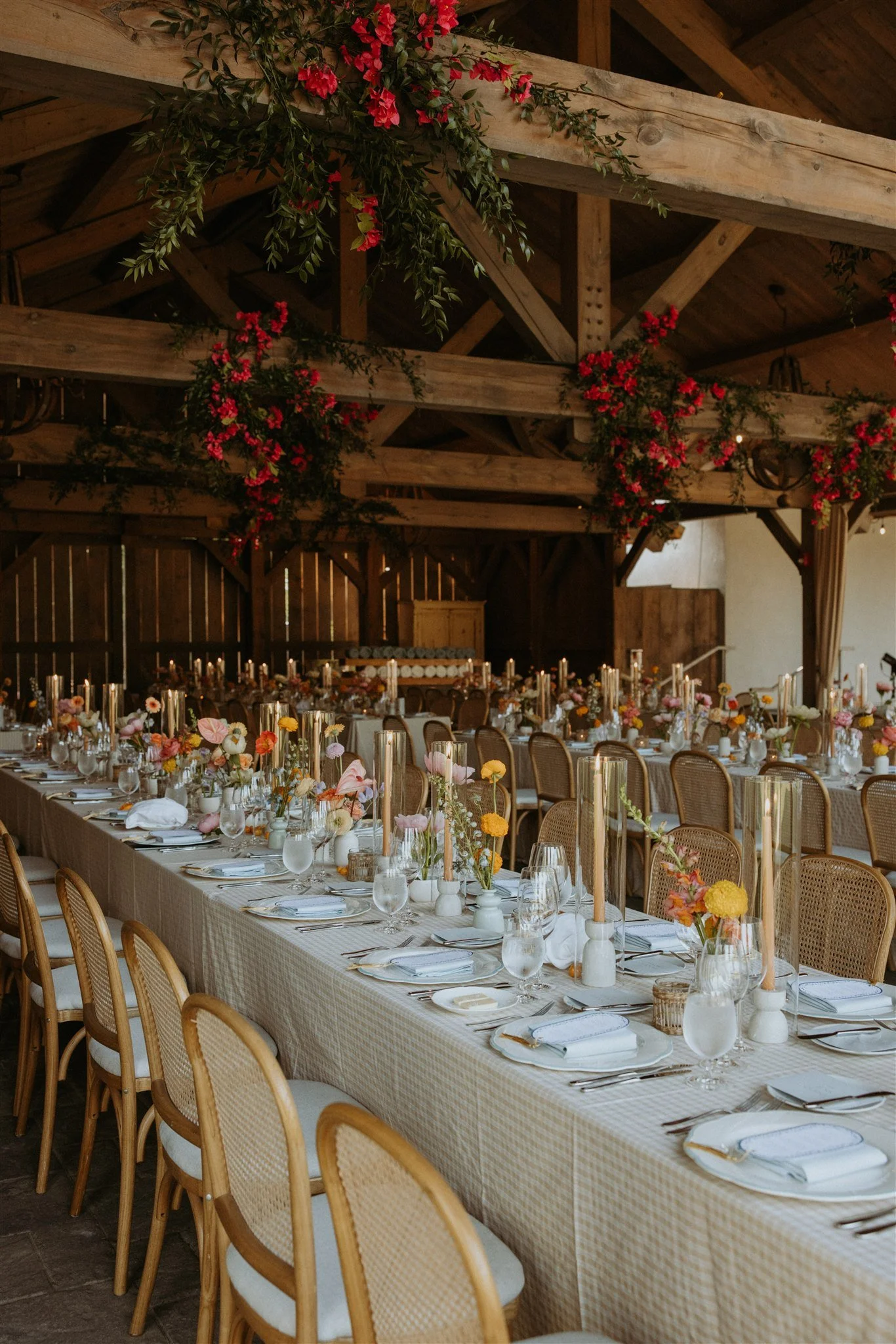 Pink flowers and greenery on the beams of the Summer House at Langdon Hall