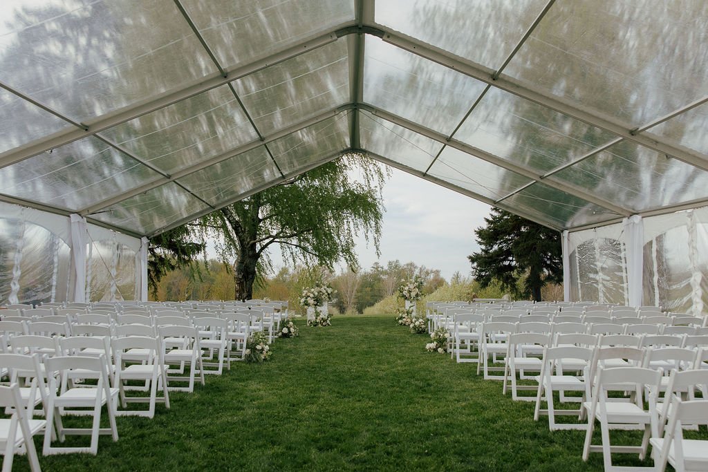 Tented outdoor ceremony at The Farm by Pearle Weddings