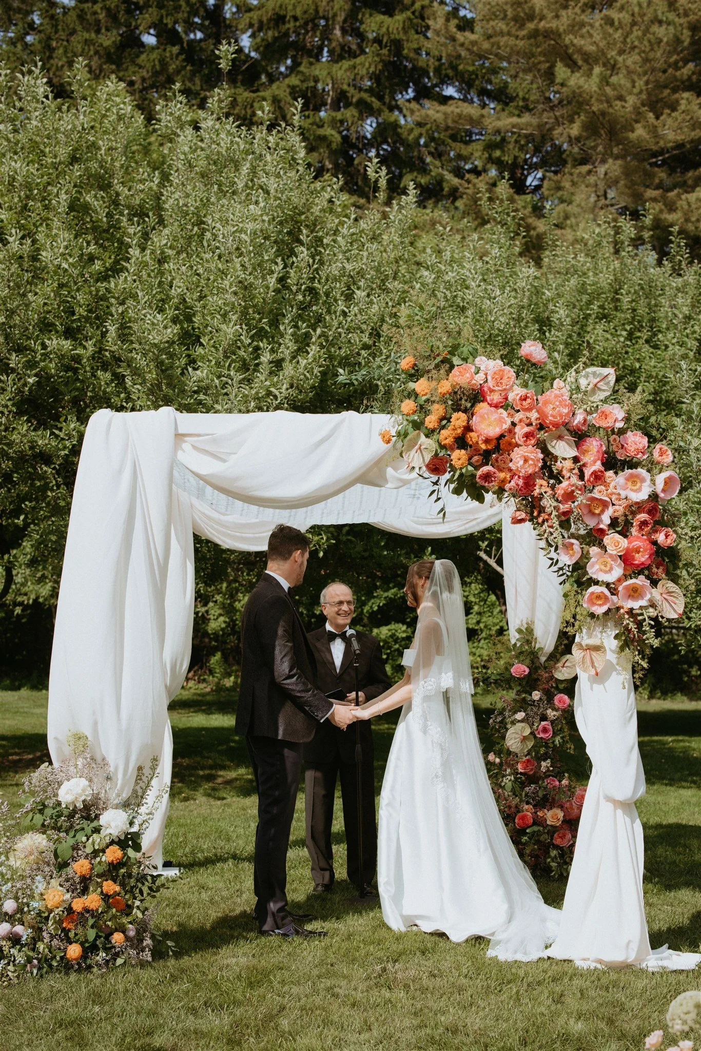 Outdoor wedding ceremony at Langdon Hall