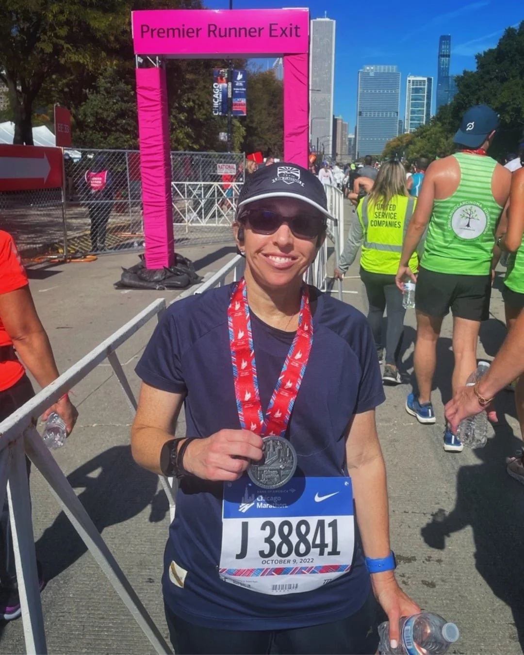 WOman posing at Chicago Marathon Finish Line