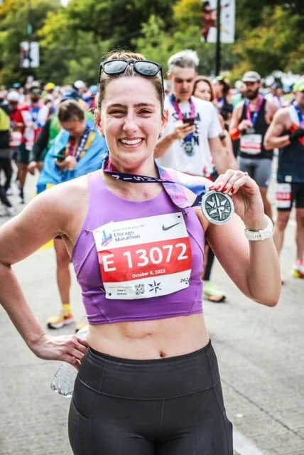 Maddie Grinning at the Chicago Marathon Finish
