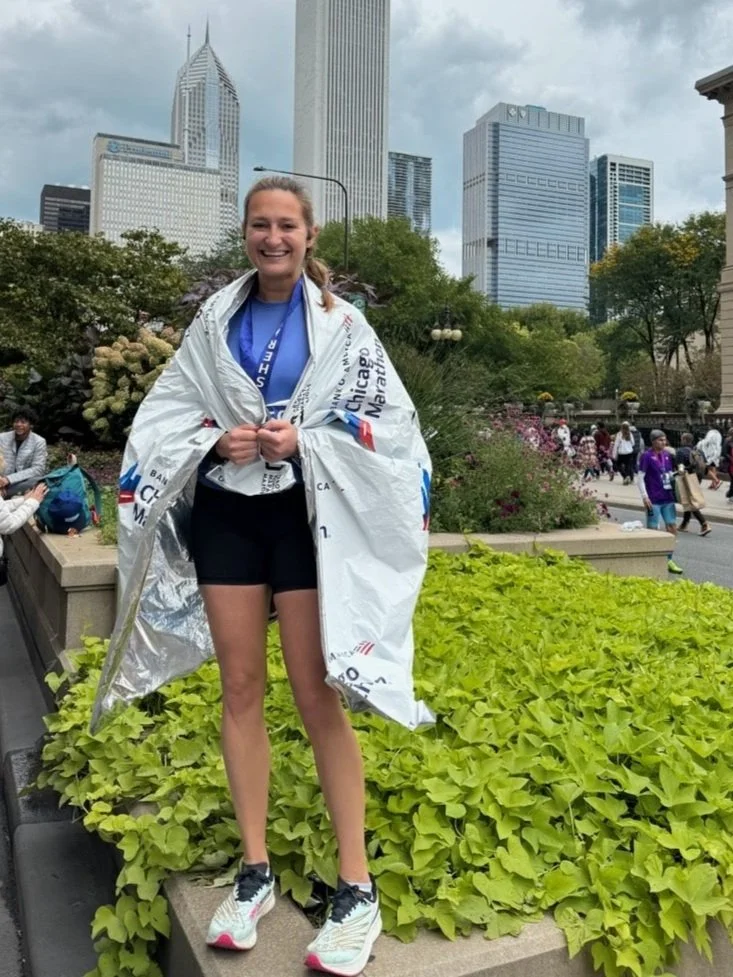 Maria smiling ear-to-ear in this post marathon photo!