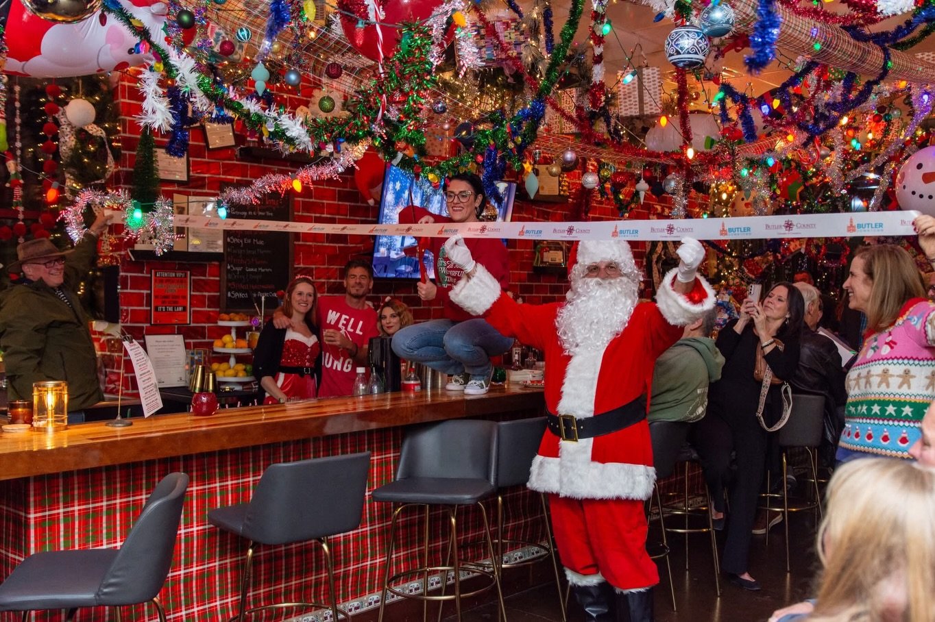 🎄✨ We were proud to join @butlerdowntown and @butlercountypa to cut the ribbon and welcome Johnny&rsquo;s Jolly Holiday Pop-Up back to Main Street for Year 3! ✂️🏙️

@johnnysdistillery is a true local gem &mdash; a split-level bar and cigar room rig