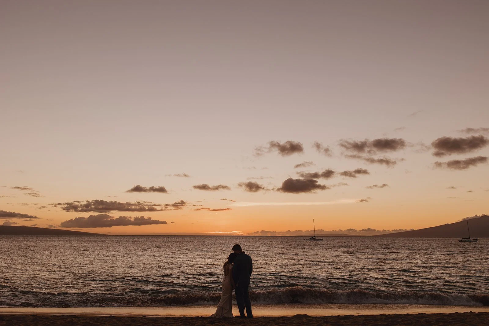Bride and Groom Kissing by the Ocean