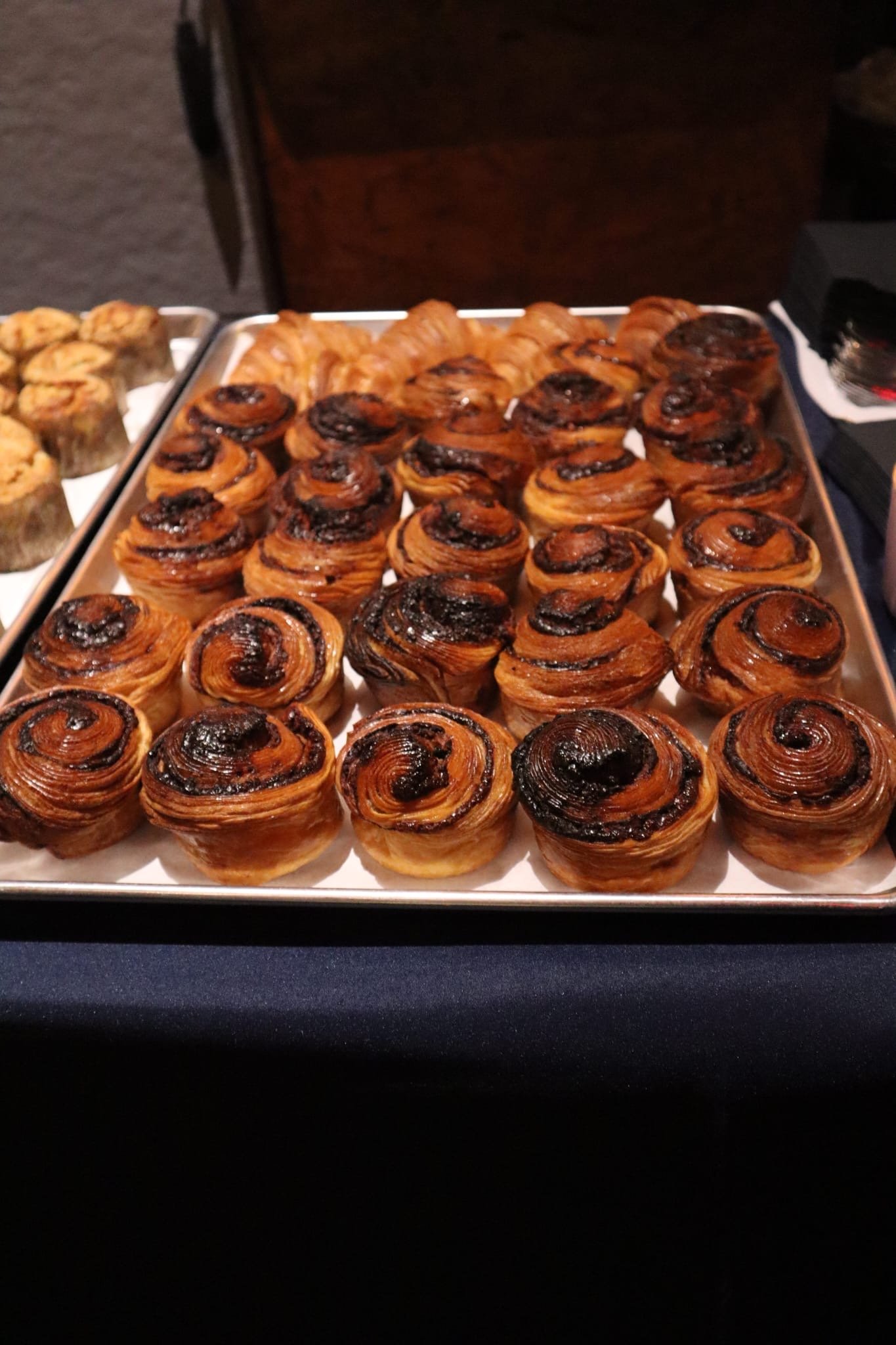 A scholarship recipient speaking at the podium to the assembled crowd.