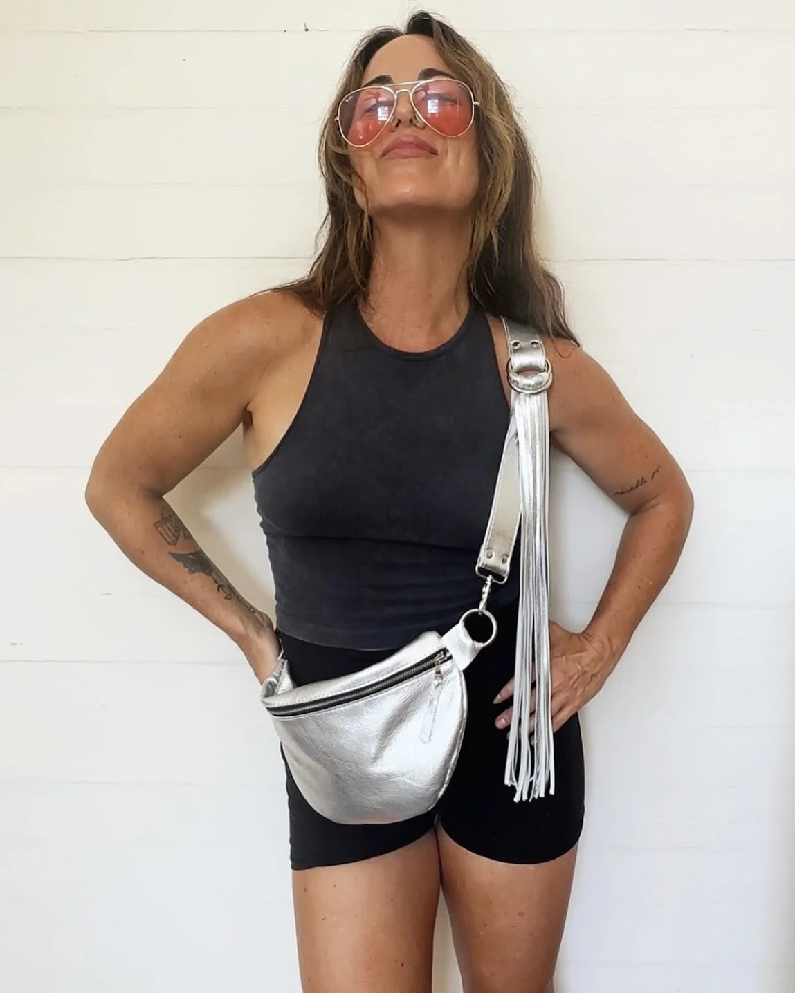 Calling all chrome queens &mdash; ride and shine with this silver REBEL SLING + WILD HEART FRINGE STRAP 🪩