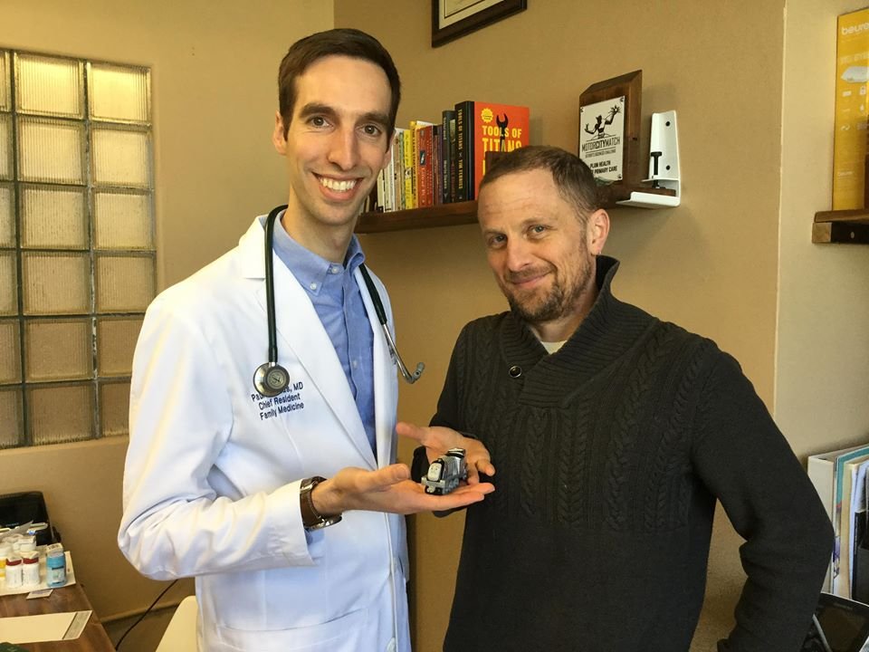 Paul Thomas MD of Plum Health DPC and Sven Gustafson of Daily Detroit with a toy train.jpg