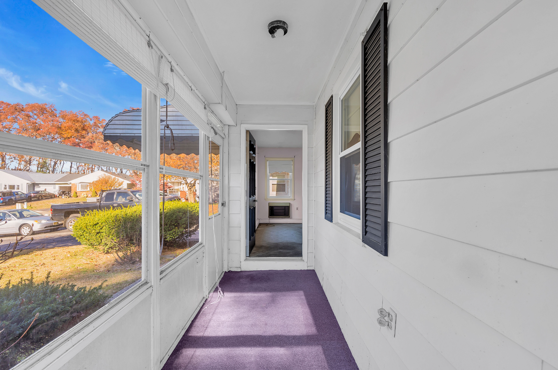 The front Florida room of 23 Yucca Ct listed by Joe Ragno at Crossroads Realty