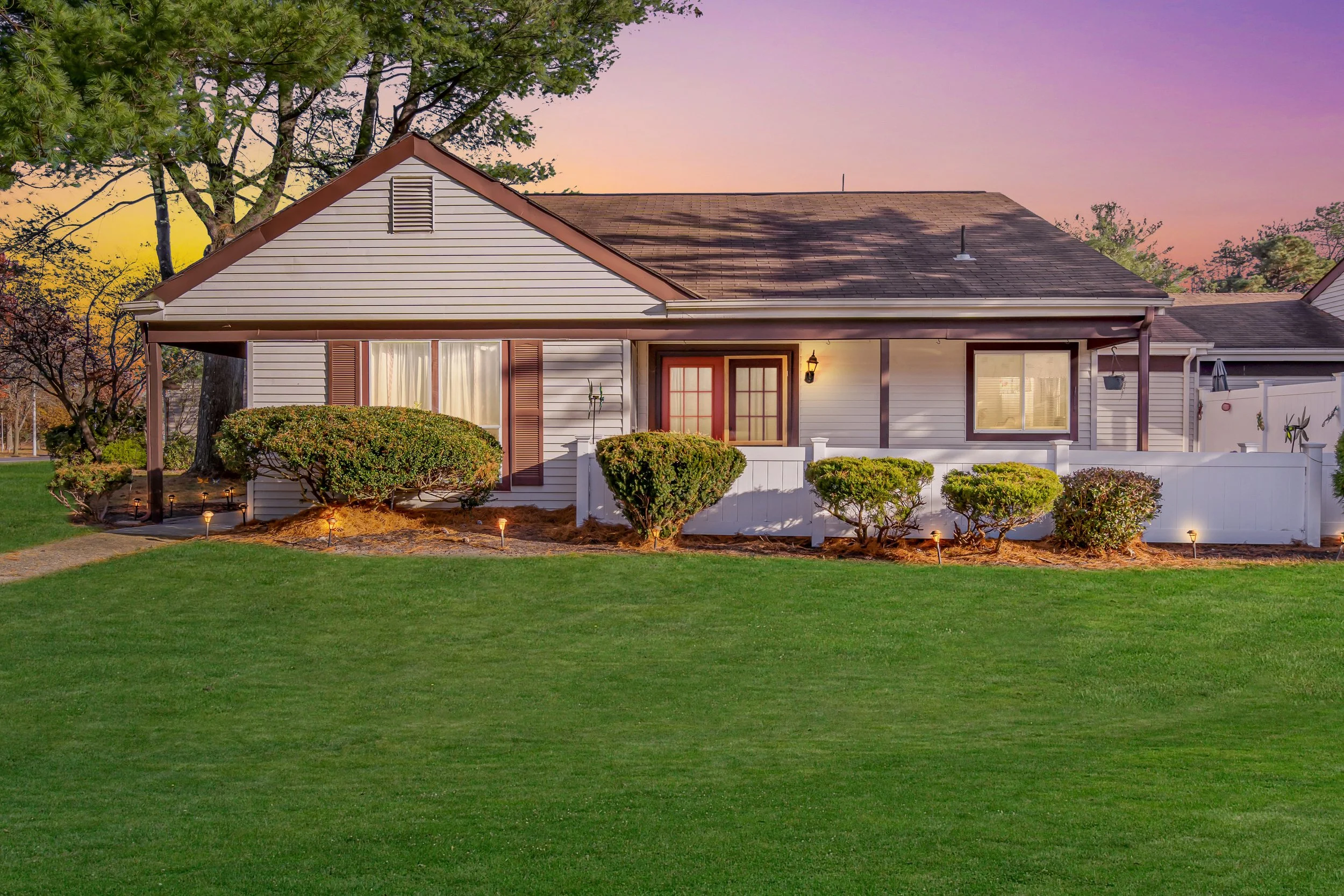 The front view of 701 Friar Ct A at Leisure Village West listed by Joe Ragno at Crossroads Realty at twilight
