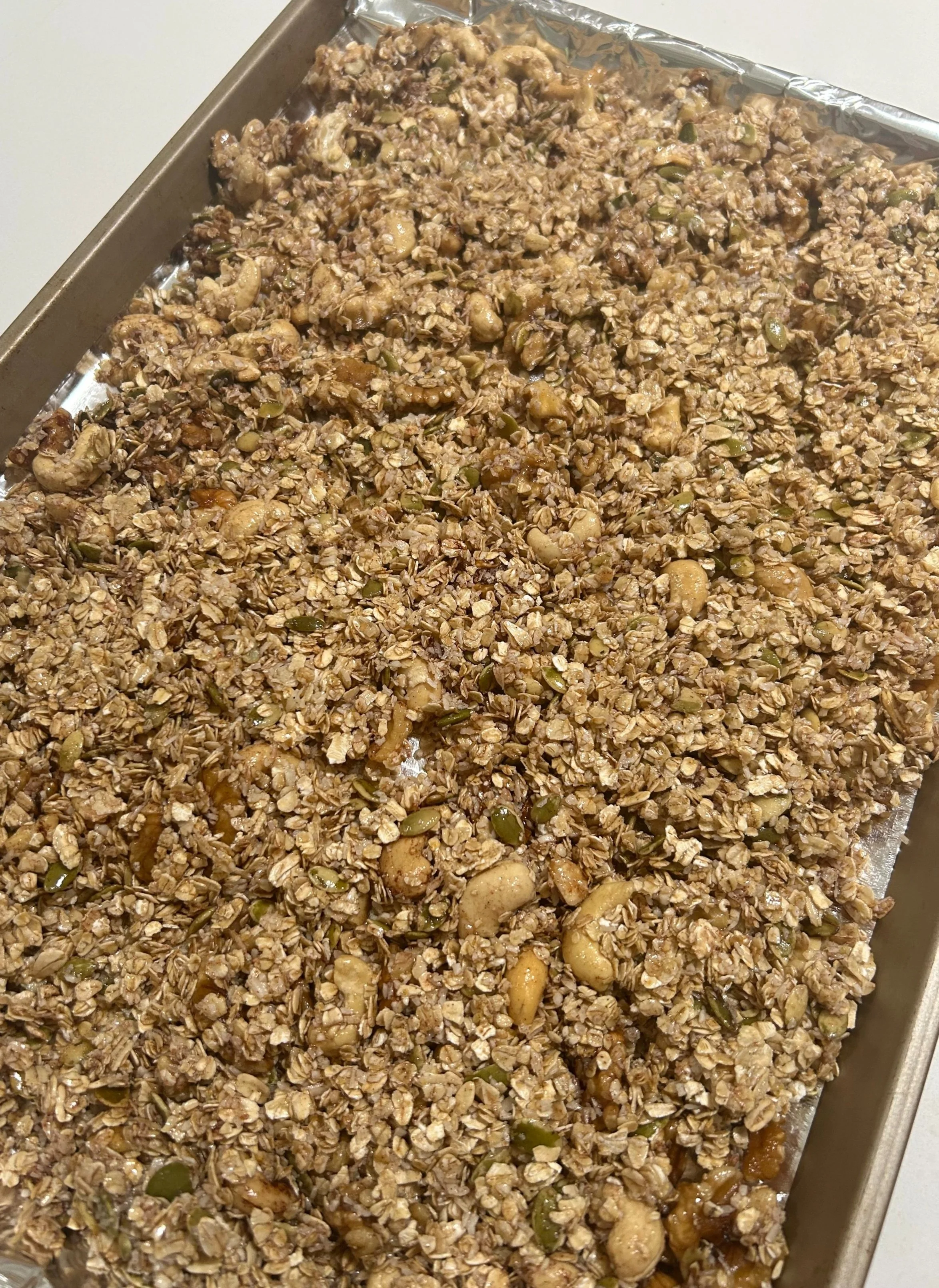 homemade cherry cinnamon granola ready to bake in the oven