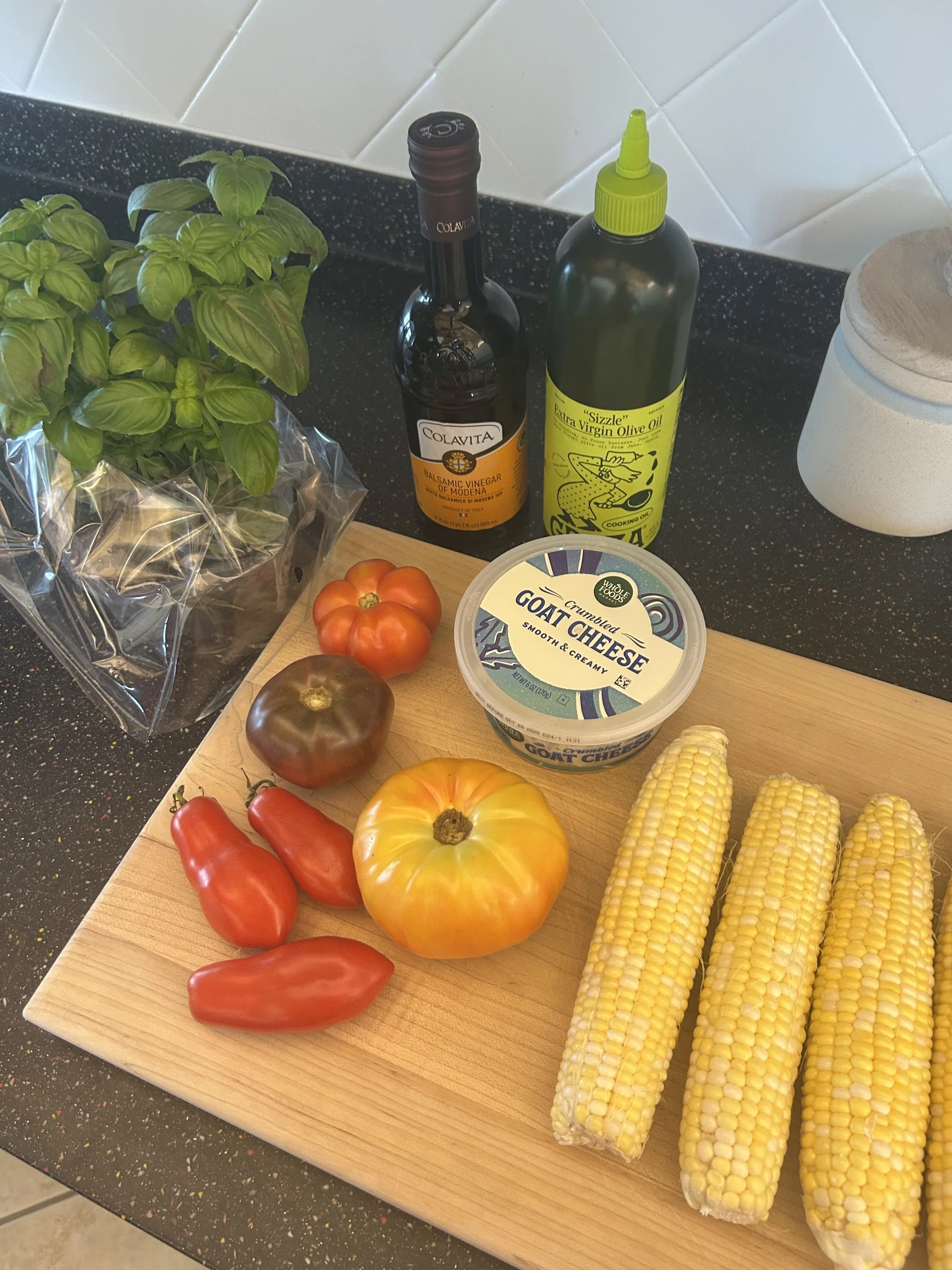 all of the ingredients needed to make this summer corn and tomato salad recipe