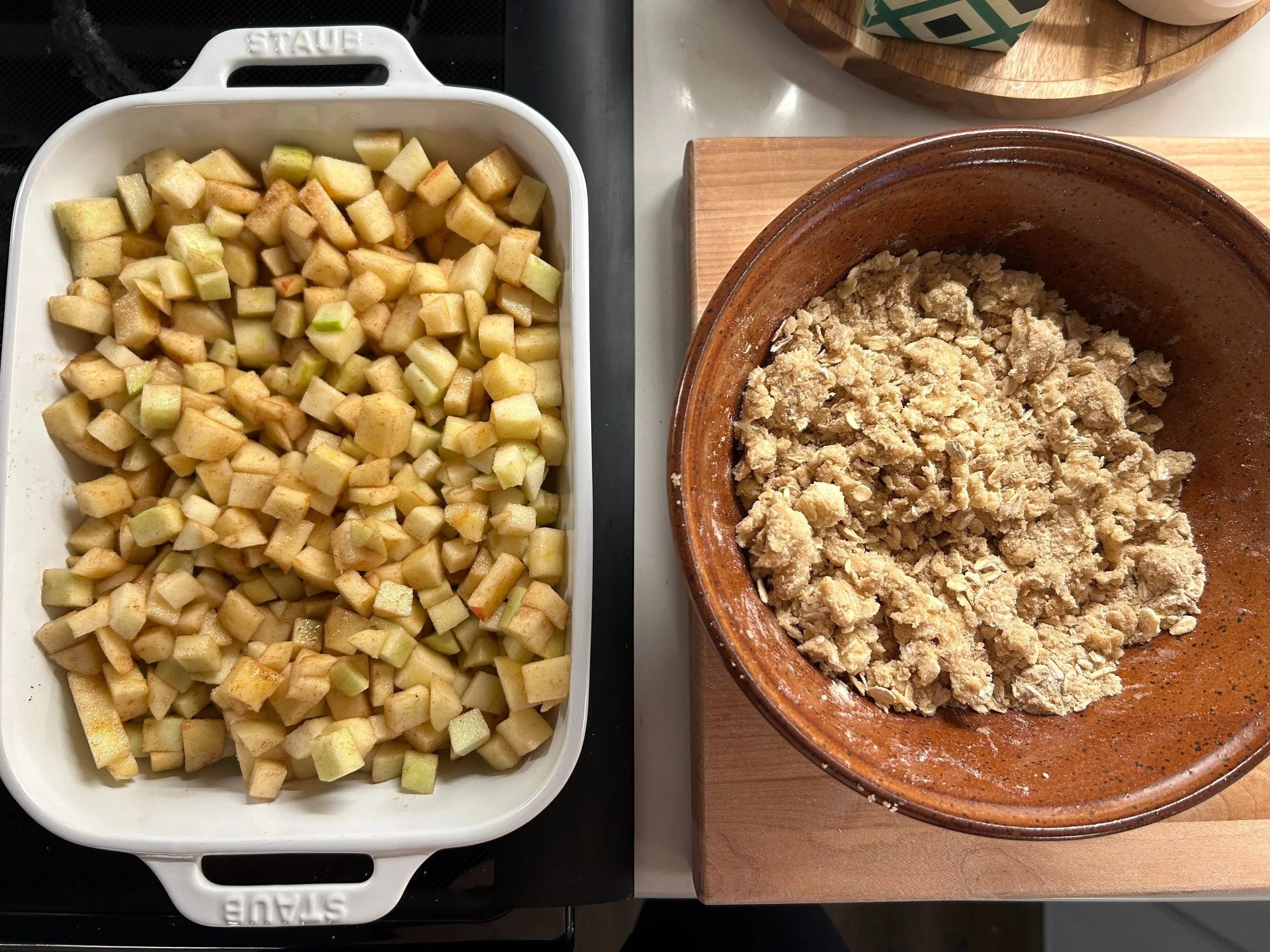 The moment in this recipe when it's time to top the apples with the crumble topping