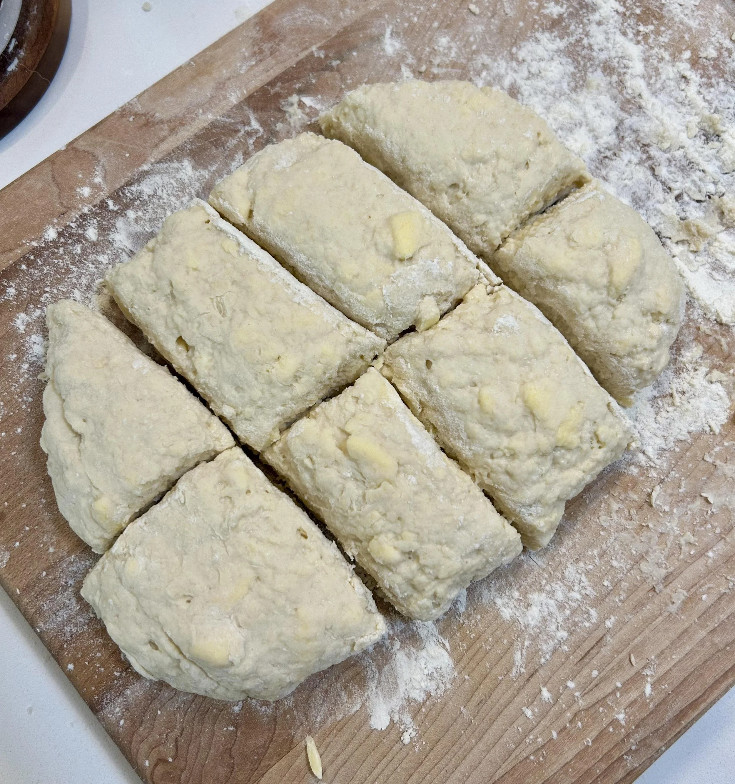 dough that has been portioned out to create 8 biscuits