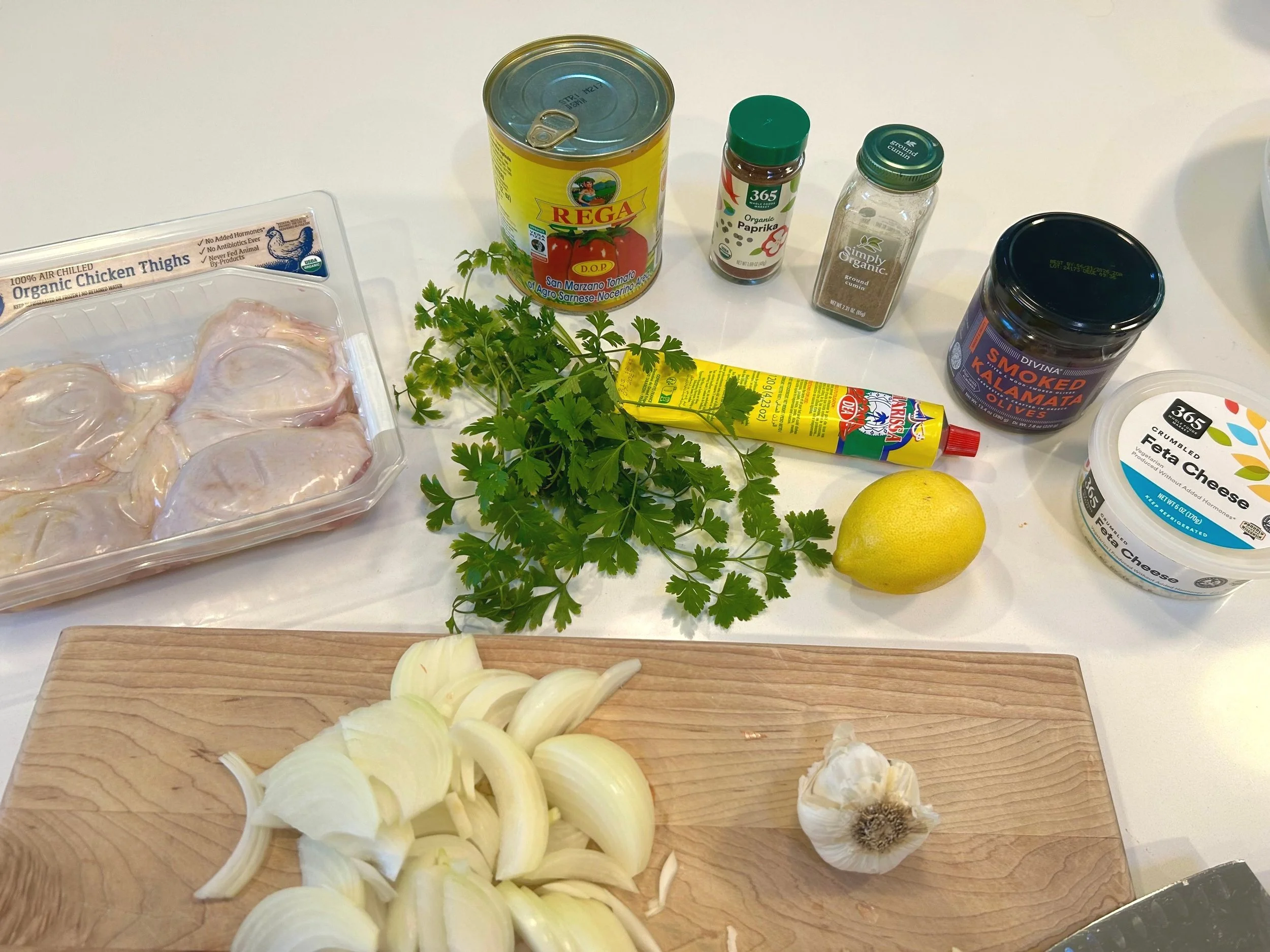 All 11 ingredients you need to create this recipe for braised chicken with tomatoes and feta