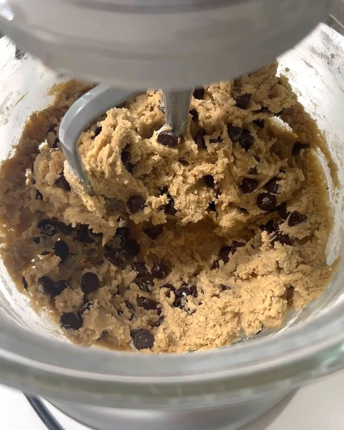 tahini chocolate chip cookie dough ready to be formed into balls and baked