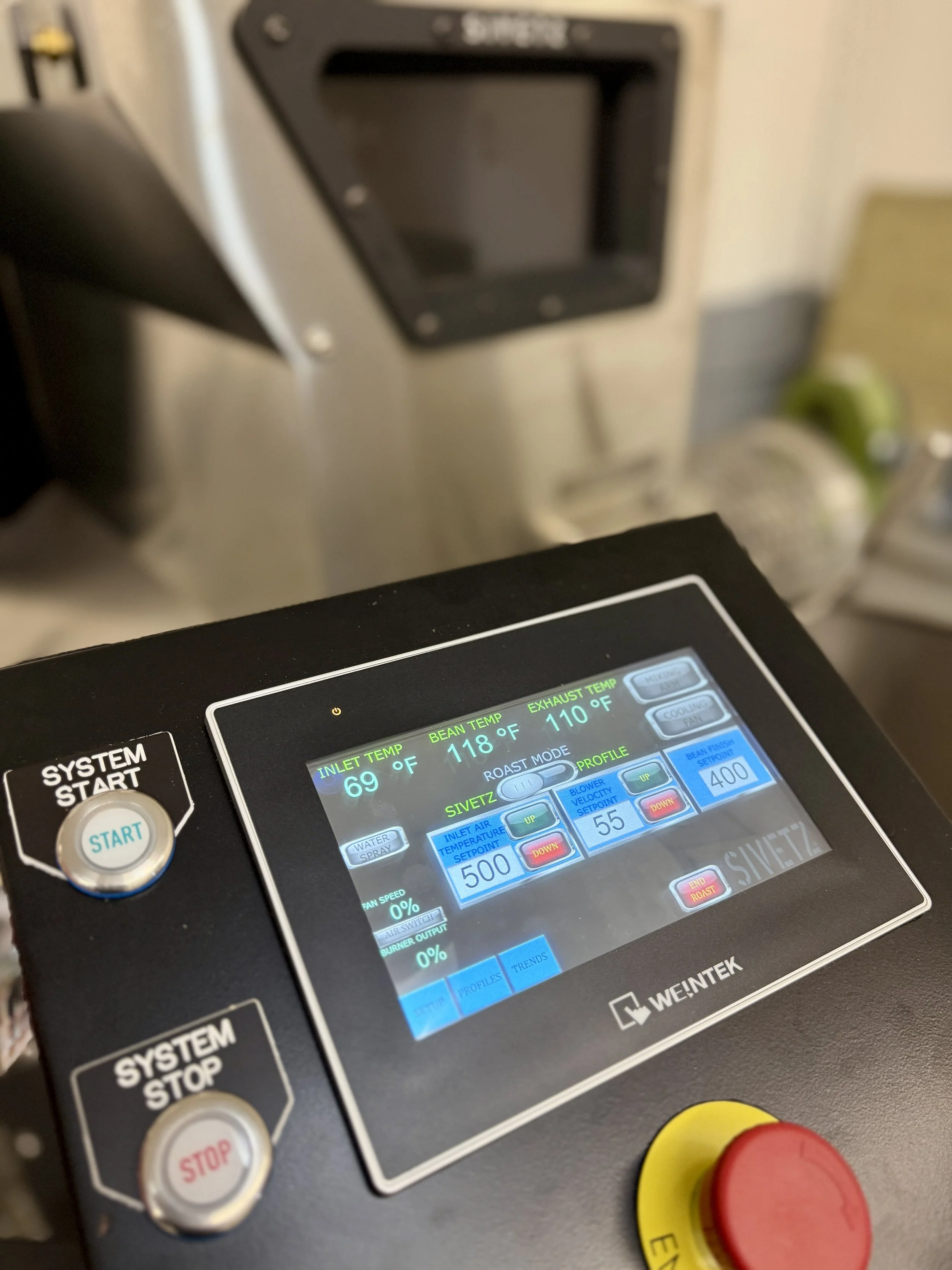 Industrial coffee roaster control panel and stainless steel roast chamber detail