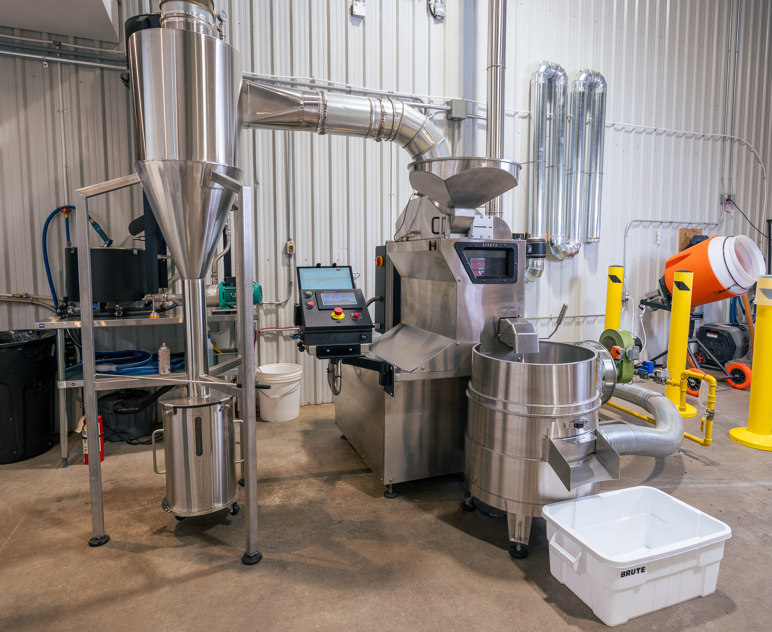 Commercial coffee roaster installed in a production roasting facility
