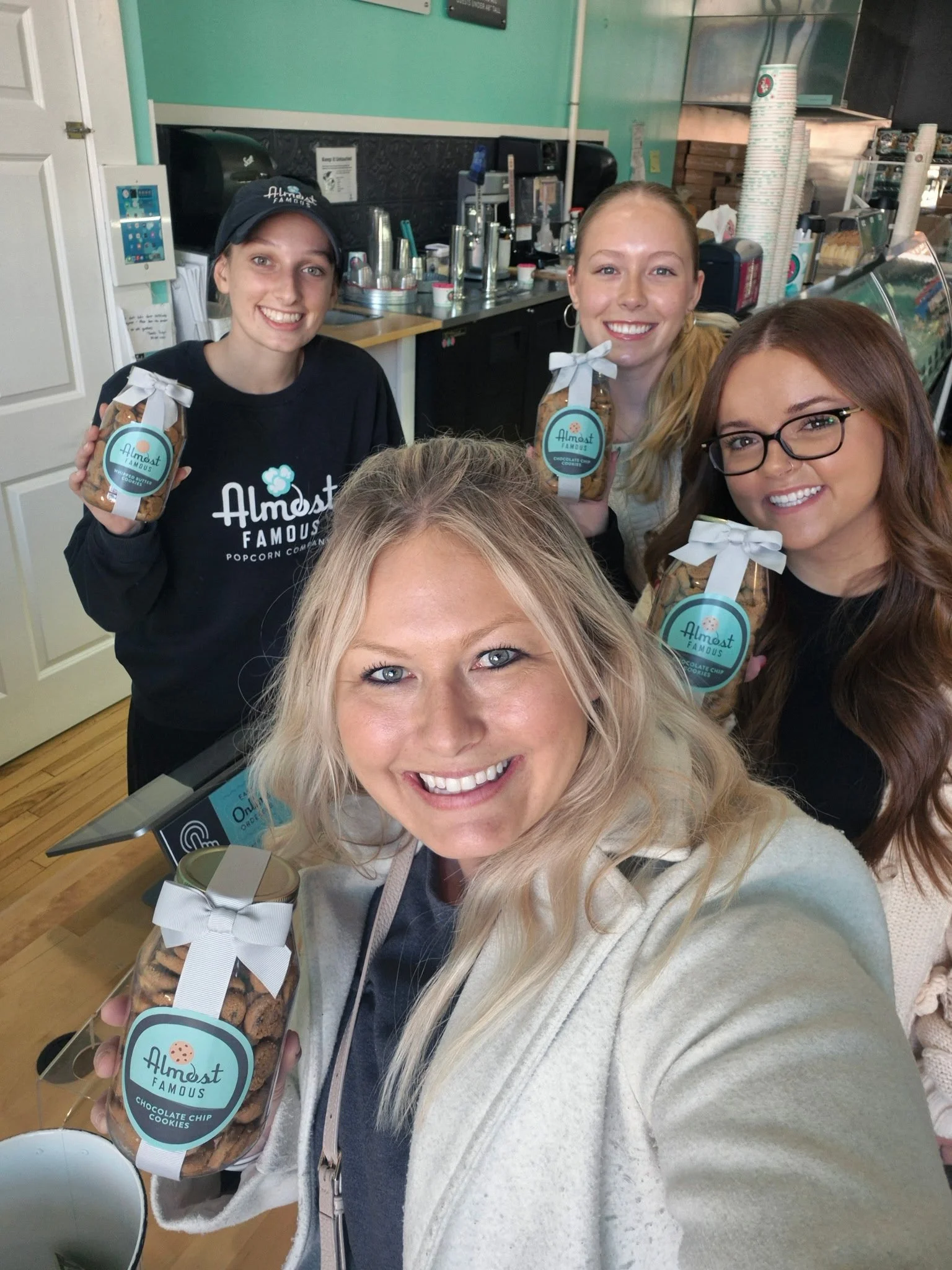 Supporting local never tasted so sweet! 🍪💙 Our team stopped by Almost Famous Popcorn to try their new mini chocolate chip cookies. 10/10 recommend! 🌟 Happy National Cookie Day!