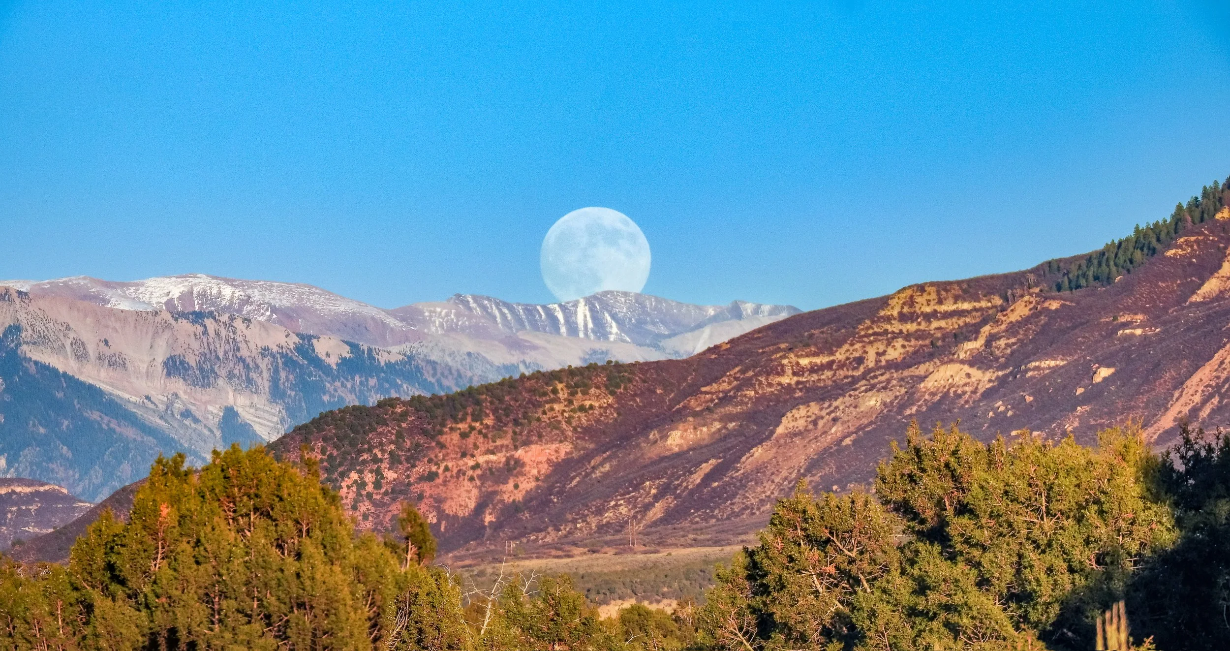 Full Beaver Moon rising over the Raggeds
