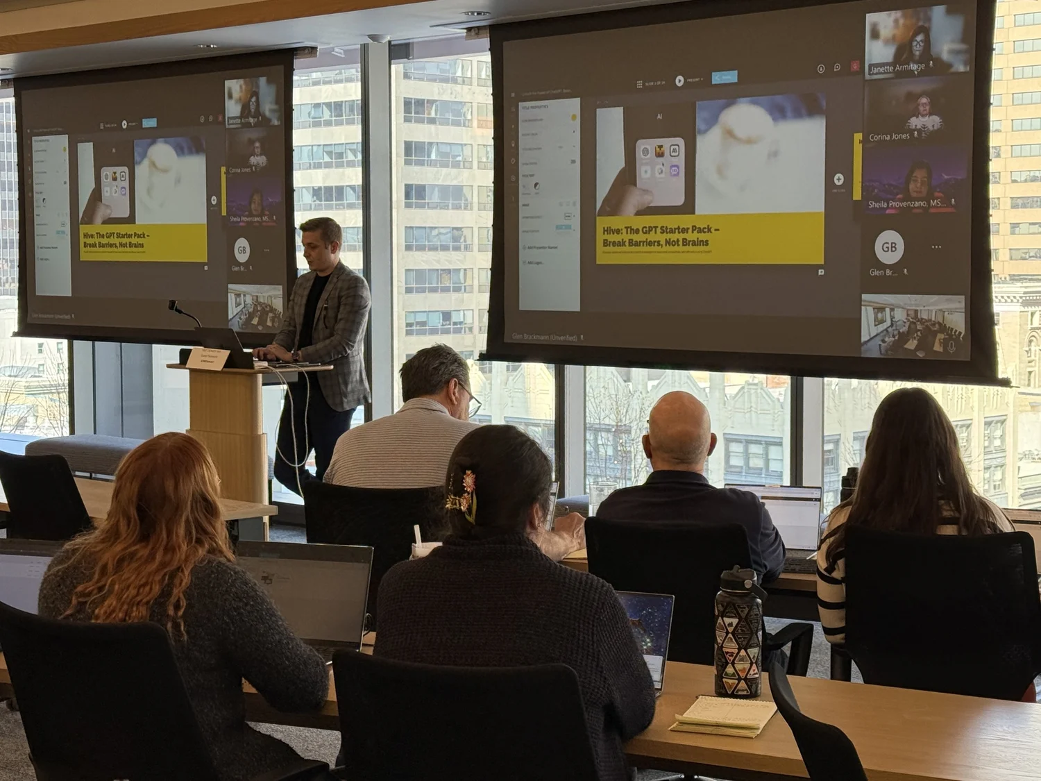 Mitch Mitchem leading a live HIVE AI training session, a room of professionals learning hands-on.