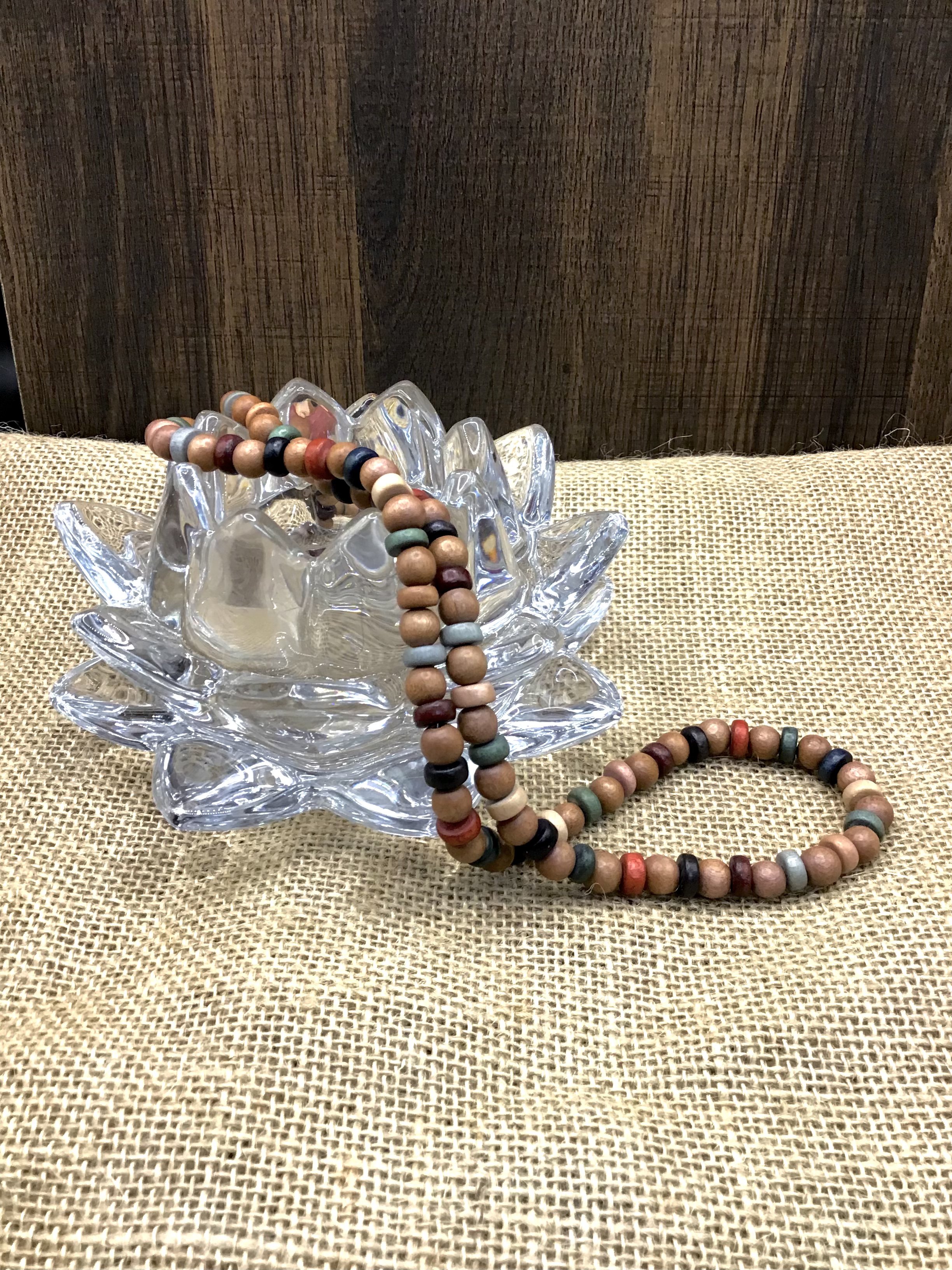 wooden colored beads on lotus.jpeg