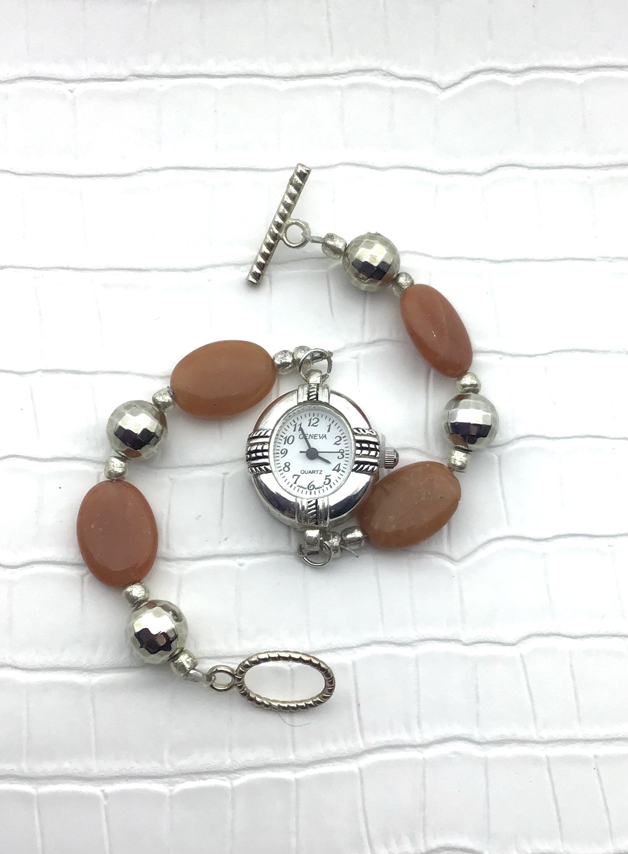 orange oval bead watch.jpeg