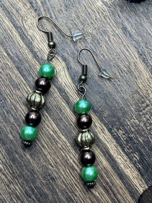 Dangle earring with green, brown, and gold accent beads.jpeg