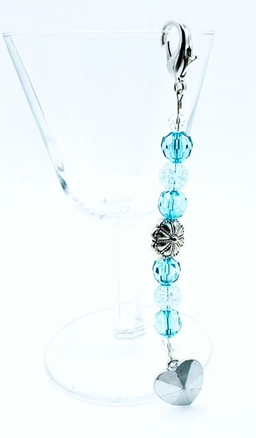 Light blue faceted bead silver sloral and heart pendant purse charm.jpeg