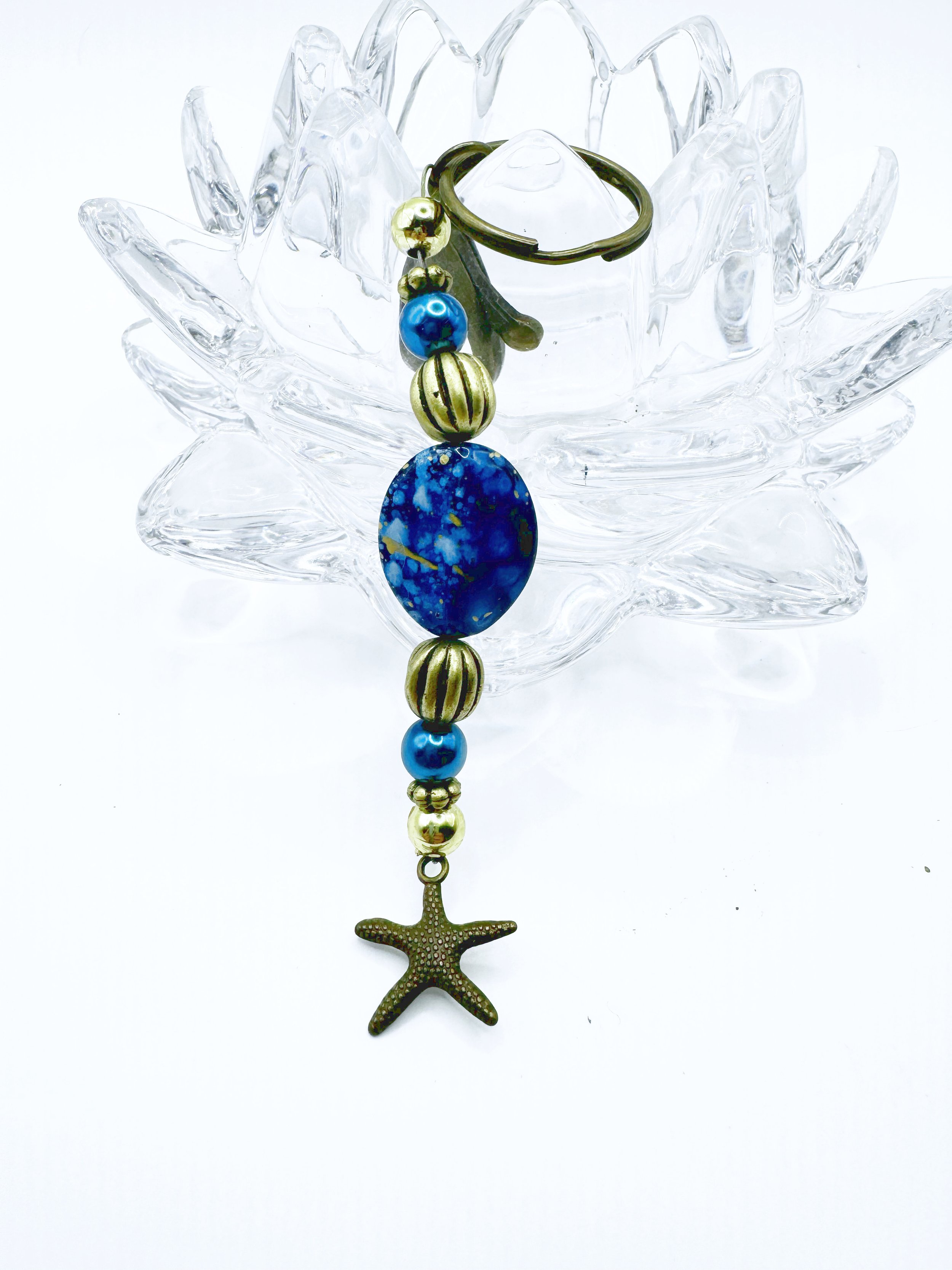Keychain with blue and gold speckled accent bead and star charm.jpg