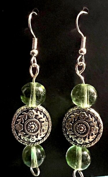 Green+trans+glass+bead+with+circle+metal+medallion.jpg