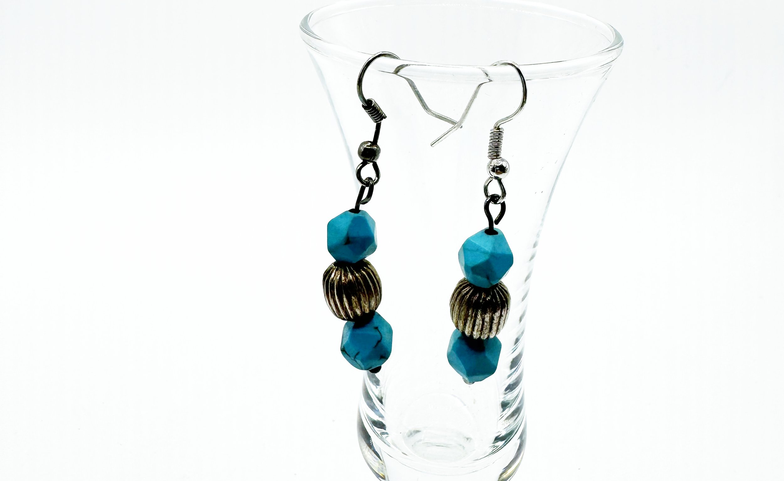 hexagon blue turq colored bead with textured silver bead.jpg