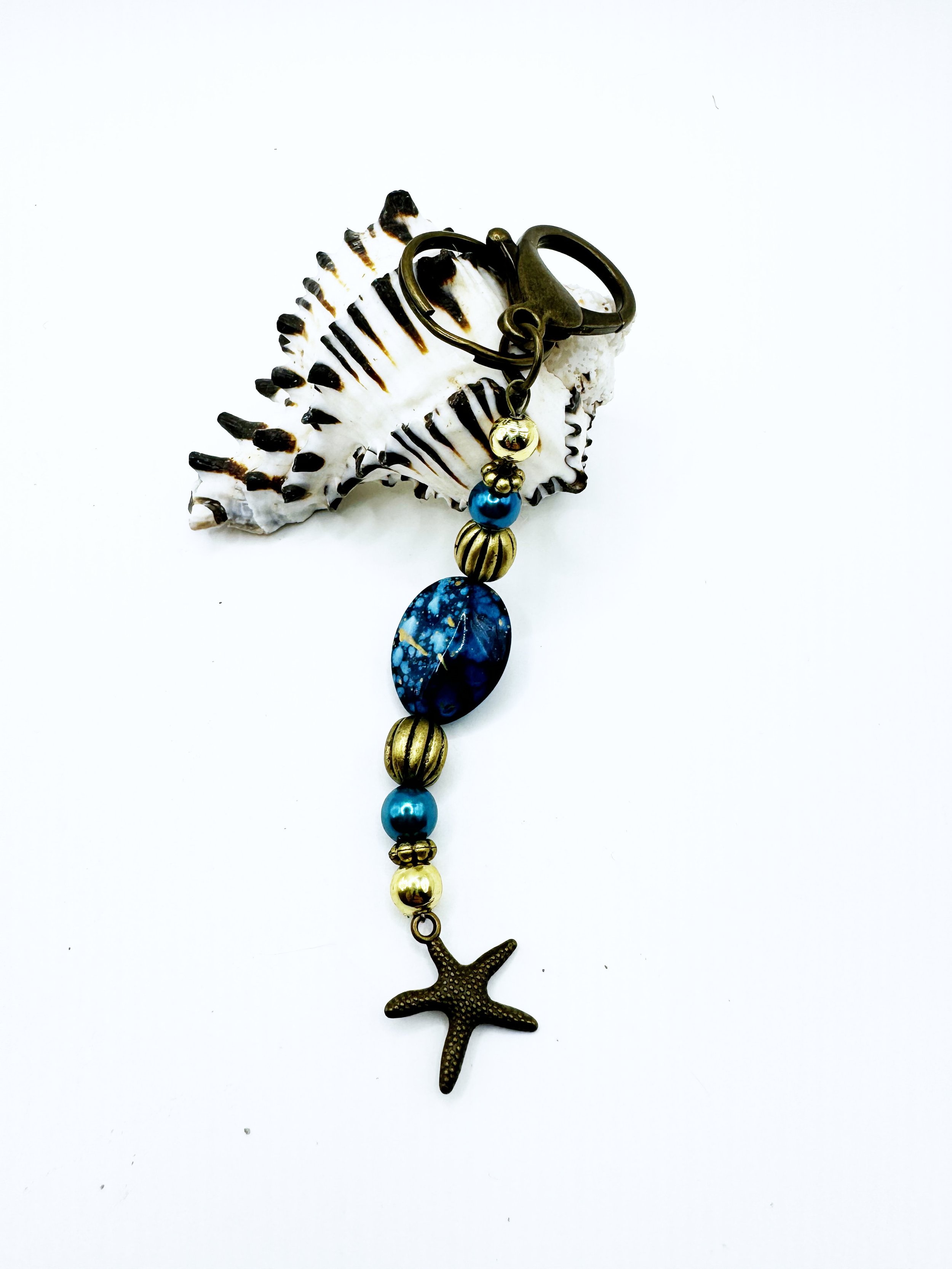 Keychain with blue and gold speckled accent bead and star charm B.jpg