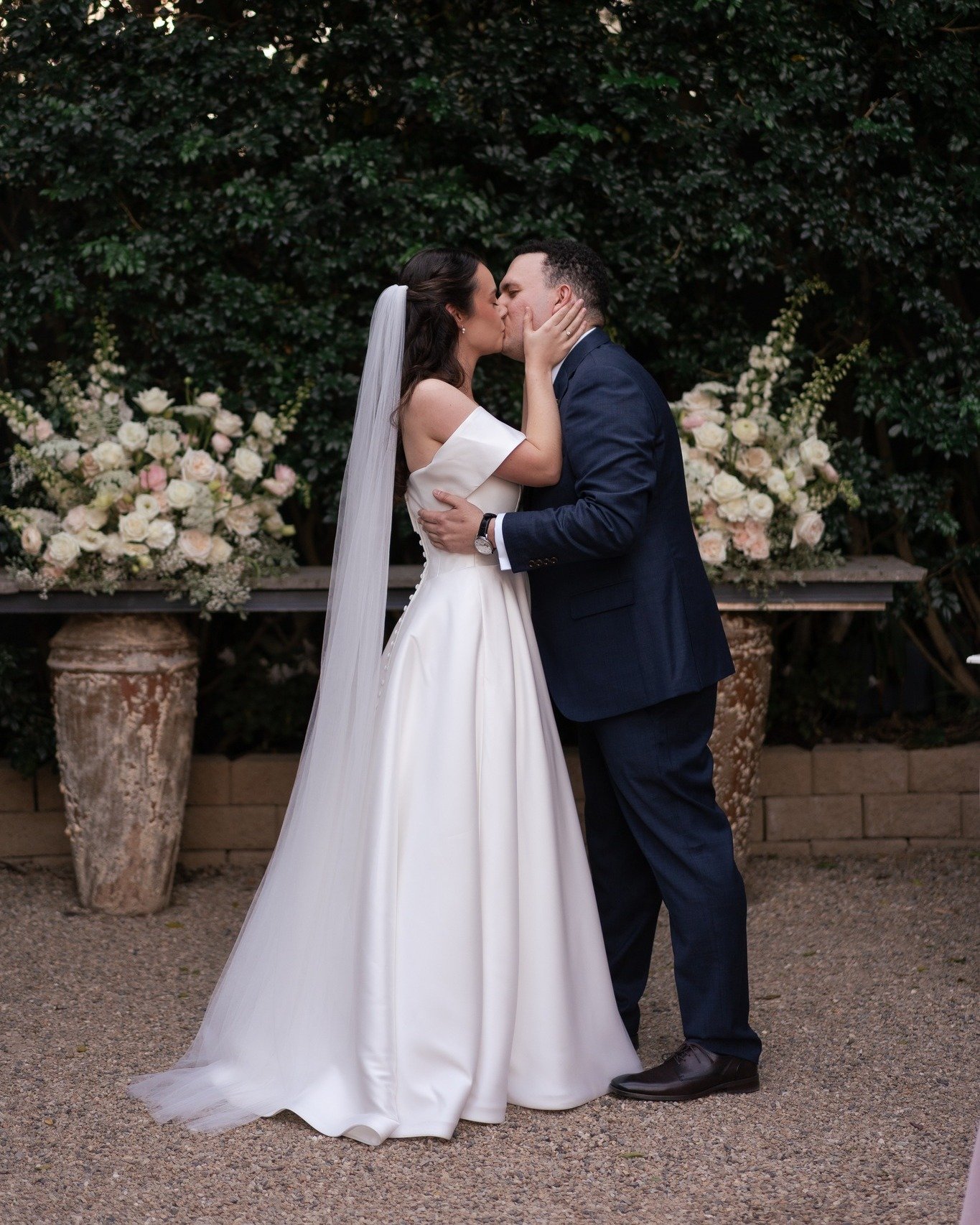For Scarlett &amp; Julian, we kept the florals soft and romantic with white and blush blooms, layered greenery and two statement arrangements framing the mantle at Hillstone Courtyard.

We loved how the flowers brought a focal point to the space whil
