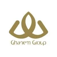 A gold-colored logo featuring an abstract geometric design with two mirrored shapes and a central pointed element, with the text 'Ghaem Group' below.