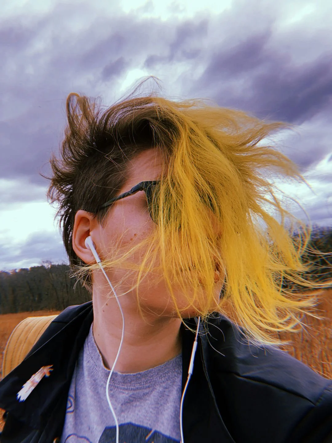 Selfie of artist Marie Enger wherein their hair consumes most of their face